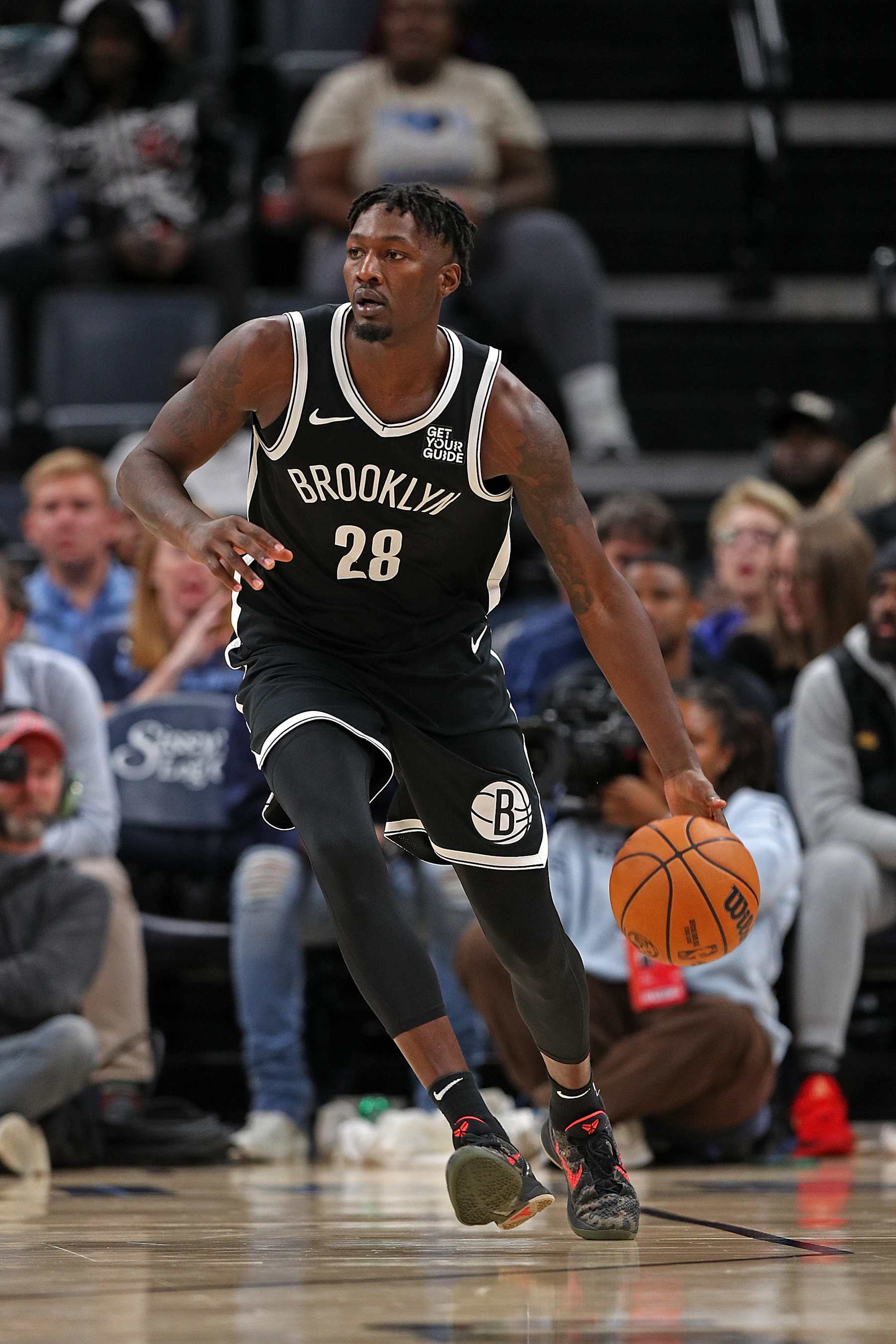 MEMPHIS, TENNESSEE - OCTOBER 30: Dorian Finney-Smith #28 of the Brooklyn Nets handles the ball during the game against the Memphis Grizzlies at FedExForum on October 30, 2024 in Memphis, Tennessee. NOTE TO USER: User expressly acknowledges and agrees that, by downloading and or using this photograph, User is consenting to the terms and conditions of the Getty Images License Agreement. (Photo by Justin Ford/Getty Images)