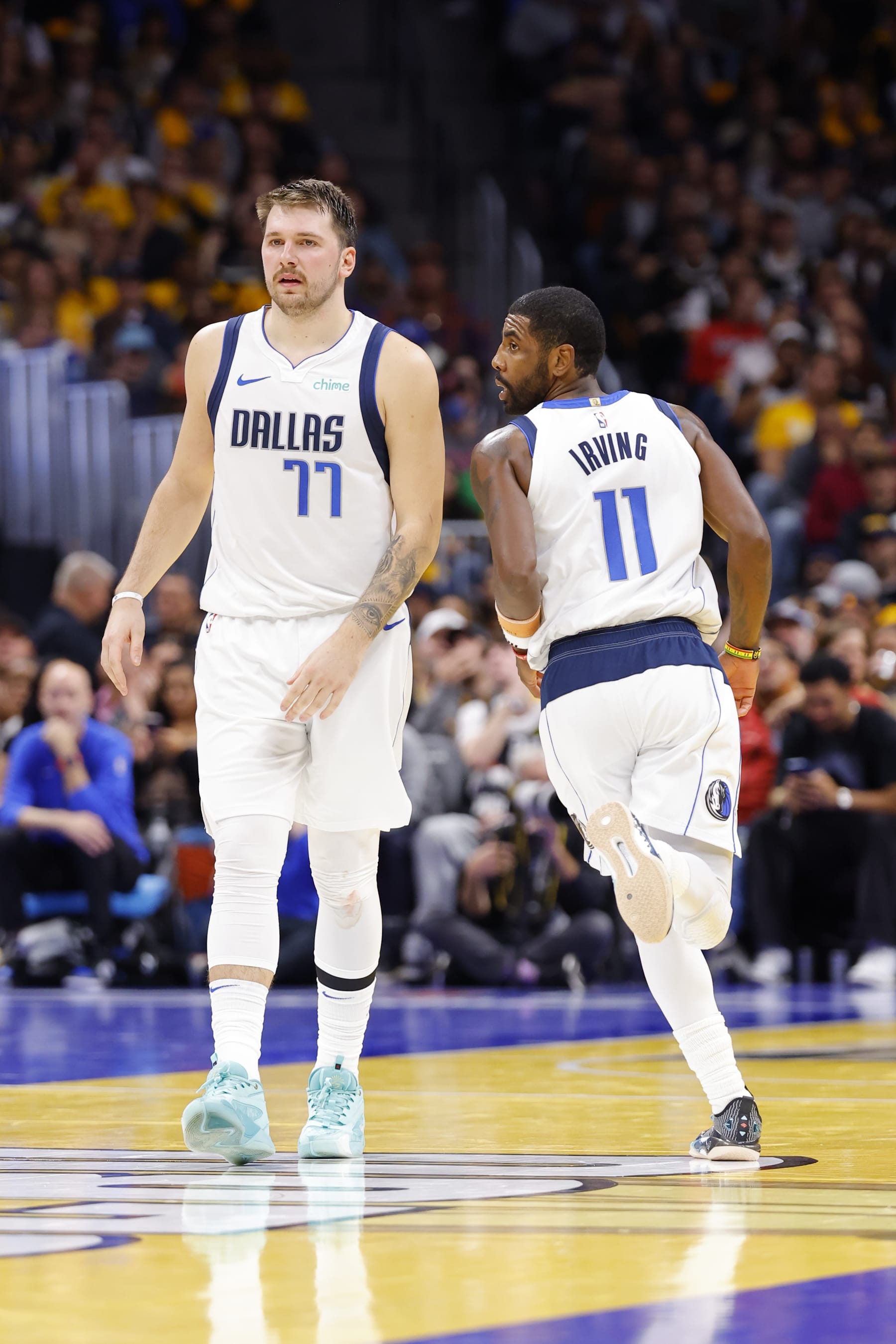 DENVER, COLORADO - NOVEMBER 3: Luka Doncic #77 of the Dallas Mavericks and Kyrie Irving #11 of the Dallas Mavericks look on against the Denver Nuggets in the third quarter during the NBA In-Season Tournament at Ball Arena on November 3, 2023 in Denver, Colorado. NOTE TO USER: User expressly acknowledges and agrees that, by downloading and or using this photograph, User is consenting to the terms and conditions of the Getty Images License Agreement. (Photo by C. Morgan Engel/Getty Images)