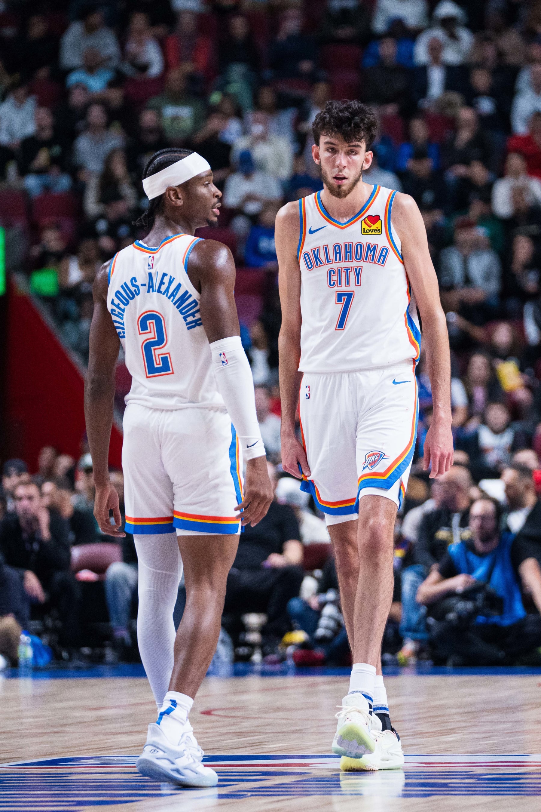 MONTREAL, CANADA - OCTOBER 12: Shai Gilgeous-Alexander #2 and Chet Holmgren #7 of the Oklahoma City Thunder looks on during the game against the Detroit Pistons on October 12, 2023 at the Bell Centre in Montreal, Canada. NOTE TO USER: User expressly acknowledges and agrees that, by downloading and or using this Photograph, user is consenting to the terms and conditions of the Getty Images License Agreement.  Mandatory Copyright Notice: Copyright 2023 NBAE (Photo by Jordan Jones/NBAE via Getty Images)