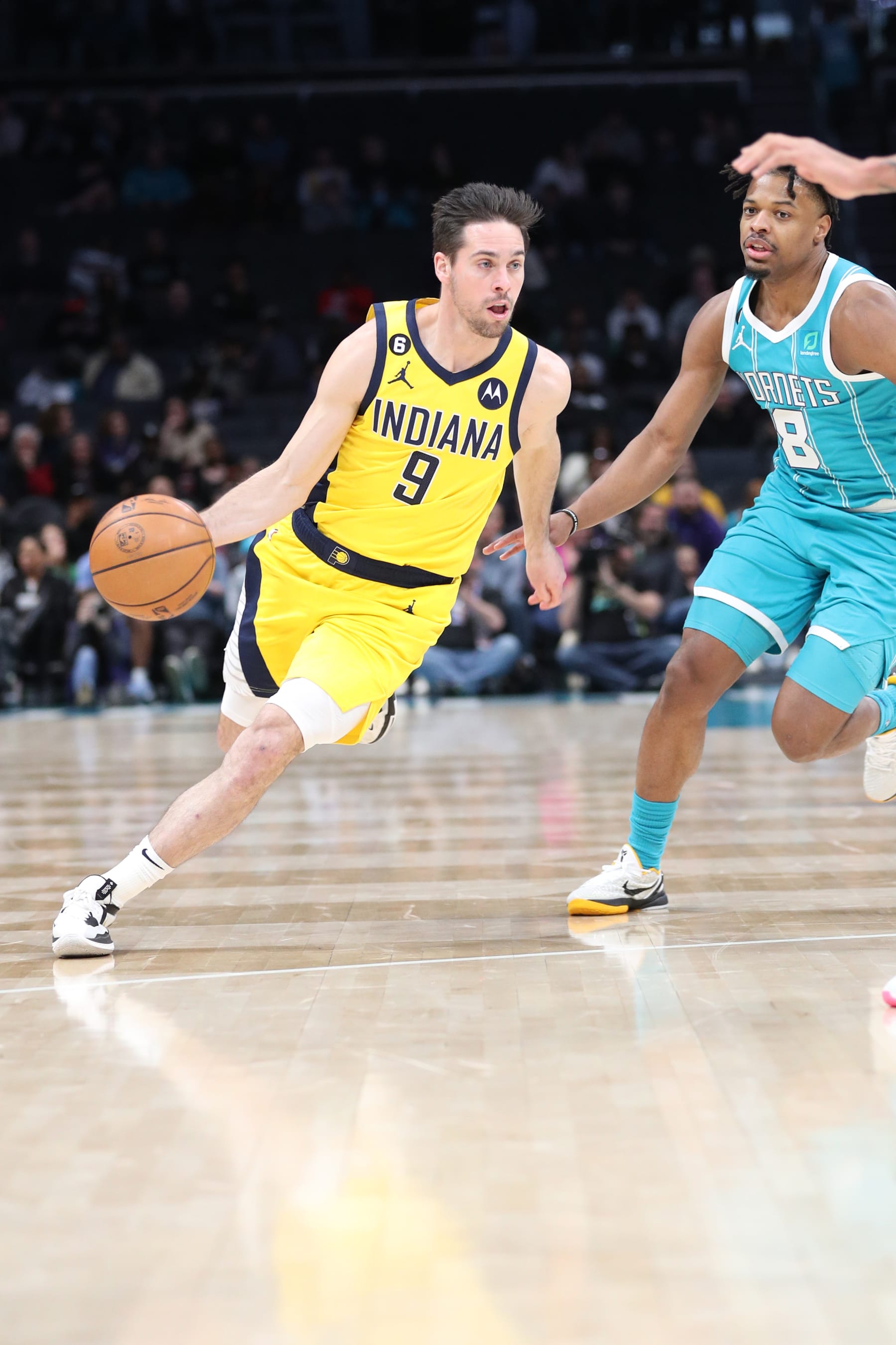 CHARLOTTE, NC - MARCH 20:  T.J. McConnell #9 of the Indiana Pacers goes to the basket on March 20, 2023 at Spectrum Center in Charlotte, North Carolina. NOTE TO USER: User expressly acknowledges and agrees that, by downloading and or using this photograph, User is consenting to the terms and conditions of the Getty Images License Agreement.  Mandatory Copyright Notice:  Copyright 2023 NBAE (Photo by Brock Williams-Smith/NBAE via Getty Images)