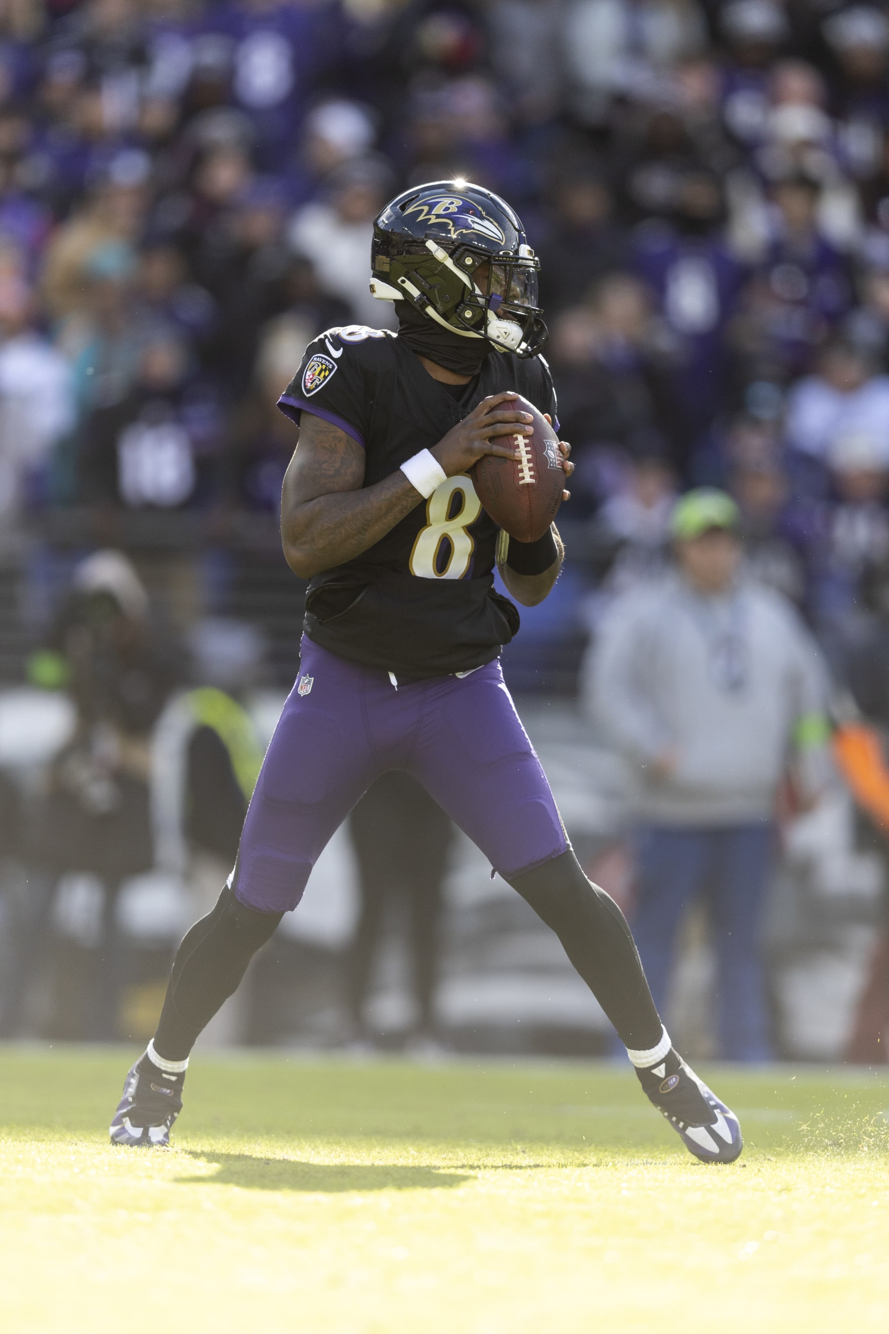 BALTIMORE, MARYLAND - DECEMBER 31: Lamar Jackson #8 of the Baltimore Ravens drops back and looks to pass during an NFL football game between the Baltimore Ravens and the Miami Dolphins at M&T Bank Stadium on December 31, 2023 in Baltimore, Maryland. (Photo by Michael Owens/Getty Images)