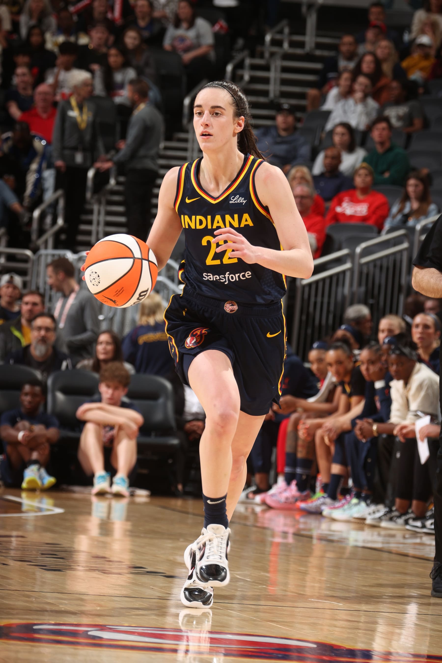 INDIANAPOLIS, IN - MAY 9: Caitlin Clark #22 of the Indiana Fever handles the ball during the game  against the Atlanta Dream during the WNBA preseason game on May 9, 2024 at Gainbridge Fieldhouse in Indianapolis, Indiana. NOTE TO USER: User expressly acknowledges and agrees that, by downloading and or using this Photograph, user is consenting to the terms and conditions of the Getty Images License Agreement. Mandatory Copyright Notice: Copyright 2024 NBAE (Photo by Nathaniel S. Butler/NBAE via Getty Images)