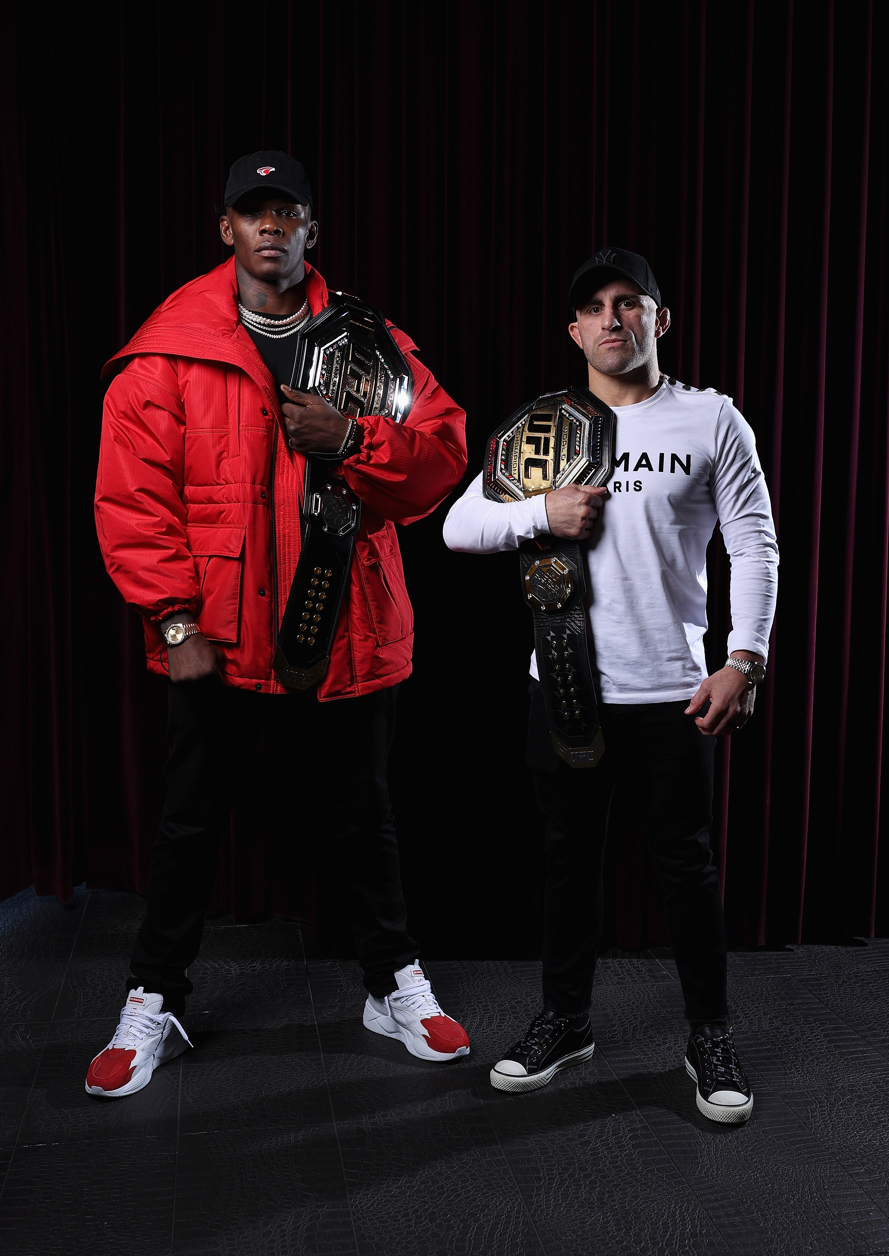 SYDNEY, AUSTRALIA - JUNE 21: UFC middleweight champion Israel Adesanya and UFC featherweight champion Alexander Volkanovski pose ahead of a media opportunity in promotion of UFC 276 (Adesanya v Cannonier) and UFC 277 (Pena v Nunes), at The Star on June 21, 2022 in Sydney, Australia. (Photo by Cameron Spencer/Getty Images for UFC)