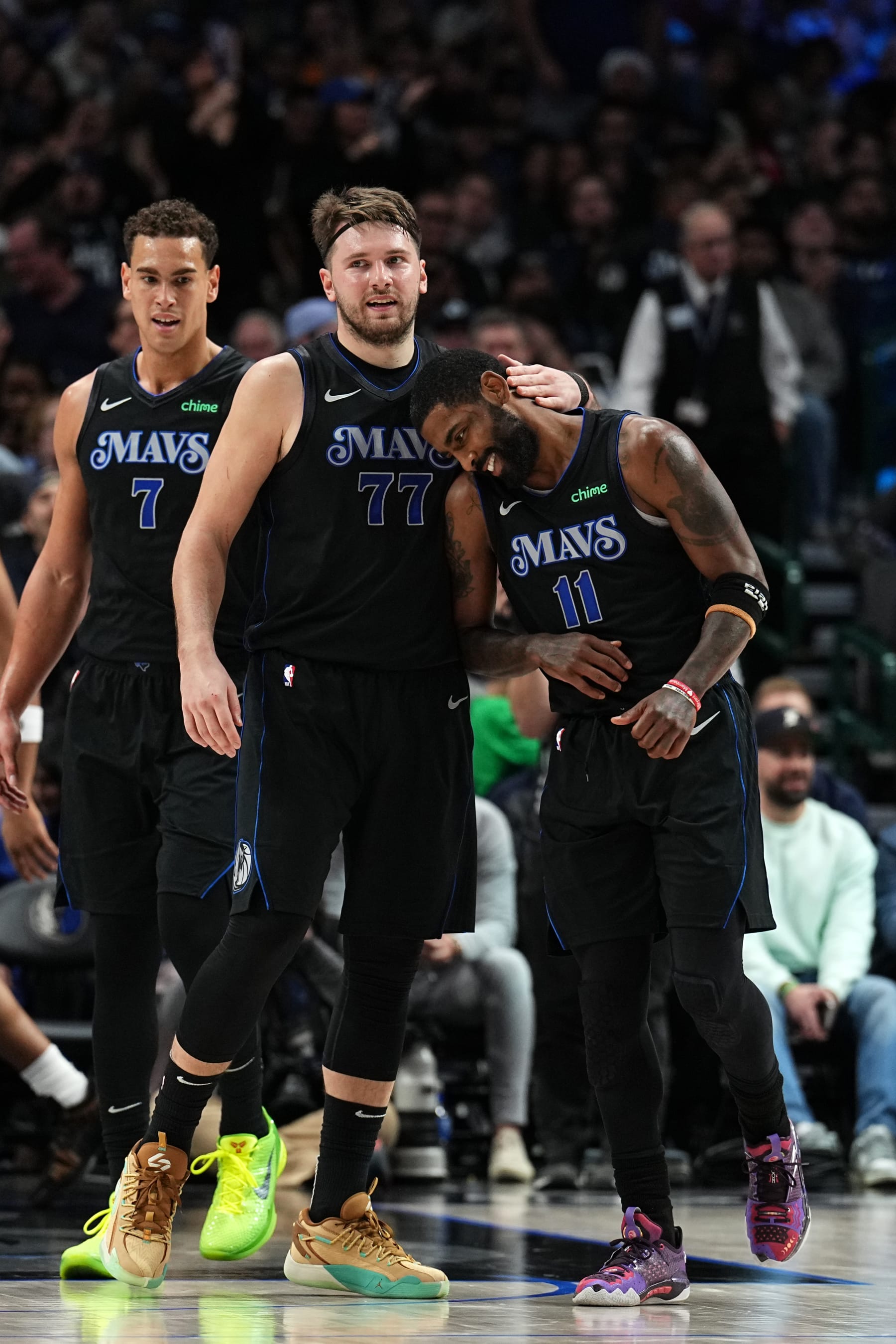 DALLAS, TX - DECEMBER 6 : Luka Doncic #77 embraces Kyrie Irving #11 of the Dallas Mavericks during the game against the Utah Jazz on December 6, 2023 at the American Airlines Center in Dallas, Texas. NOTE TO USER: User expressly acknowledges and agrees that, by downloading and or using this photograph, User is consenting to the terms and conditions of the Getty Images License Agreement. Mandatory Copyright Notice: Copyright 2023 NBAE (Photo by Glenn James/NBAE via Getty Images)