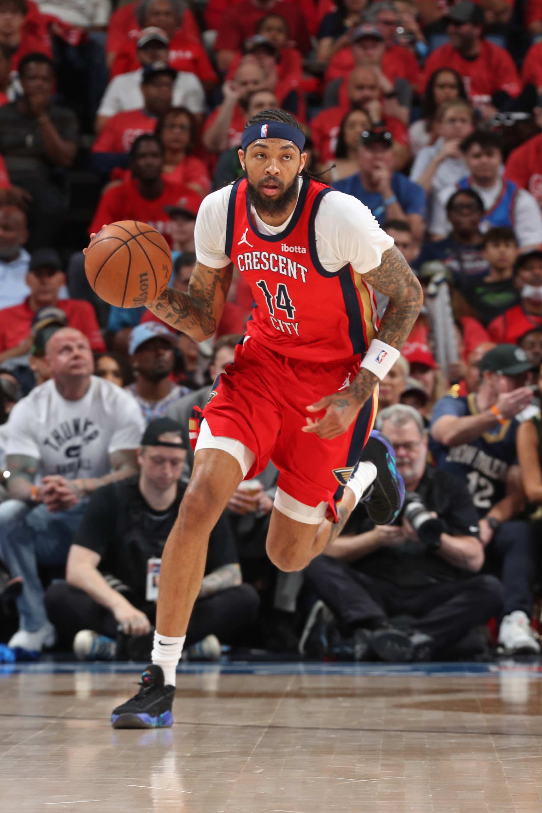 NEW ORLEANS, LA - APRIL 27: Brandon Ingram #14 of the New Orleans Pelicans brings the ball up court during the game against the Oklahoma City Thunder during Round 1 Game 3 of the 2024 NBA Playoffs on April 27, 2024 at the Smoothie King Center in New Orleans, Louisiana. NOTE TO USER: User expressly acknowledges and agrees that, by downloading and or using this Photograph, user is consenting to the terms and conditions of the Getty Images License Agreement. Mandatory Copyright Notice: Copyright 2024 NBAE (Photo by Layne Murdoch Jr./NBAE via Getty Images)