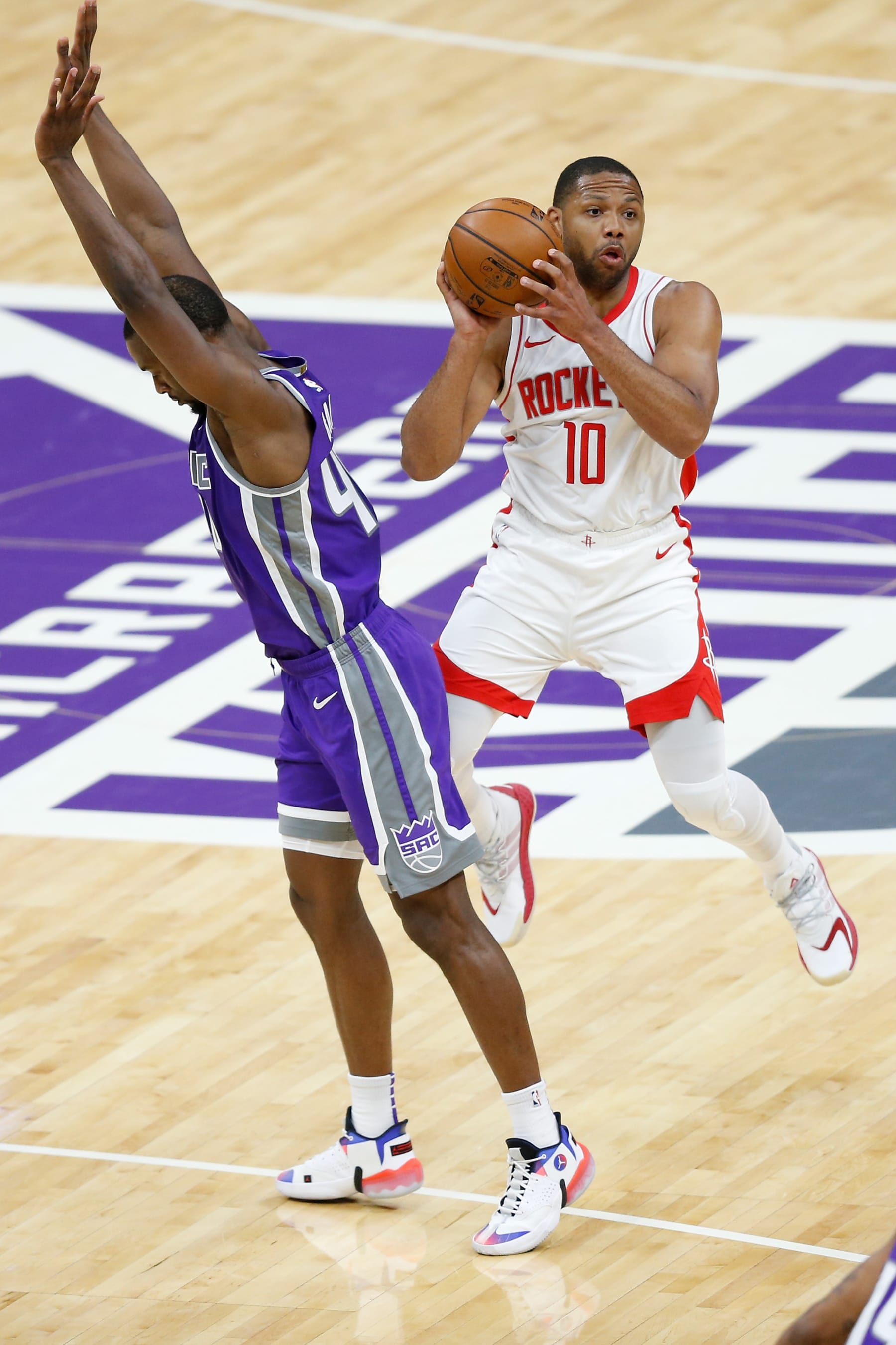 SACRAMENTO, CALIFORNIA - MARCH 11: Eric Gordon #10 of the Houston Rockets competes against Harrison Barnes #40 of the Sacramento Kings in the first half at Golden 1 Center on March 11, 2021 in Sacramento, California. NOTE TO USER: User expressly acknowledges and agrees that, by downloading and or using this photograph, User is consenting to the terms and conditions of the Getty Images License Agreement. (Photo by Lachlan Cunningham/Getty Images)