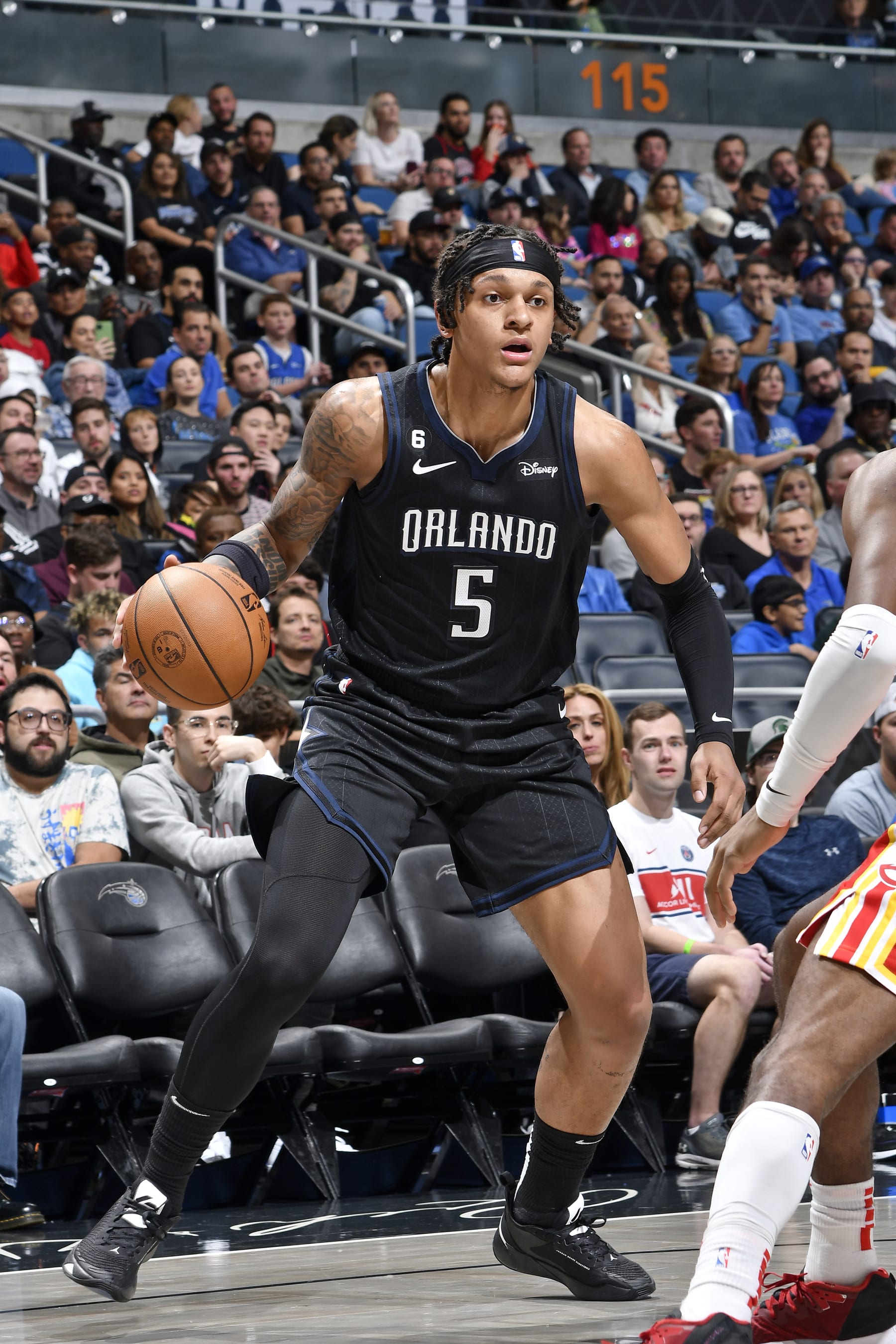 ORLANDO, FL - DECEMBER 14: Paolo Banchero #5 of the Orlando Magic dribbles the ball against the Atlanta Hawks on December 14, 2022 at Amway Center in Orlando, Florida. NOTE TO USER: User expressly acknowledges and agrees that, by downloading and or using this photograph, User is consenting to the terms and conditions of the Getty Images License Agreement. Mandatory Copyright Notice: Copyright 2022 NBAE (Photo by Fernando Medina/NBAE via Getty Images)