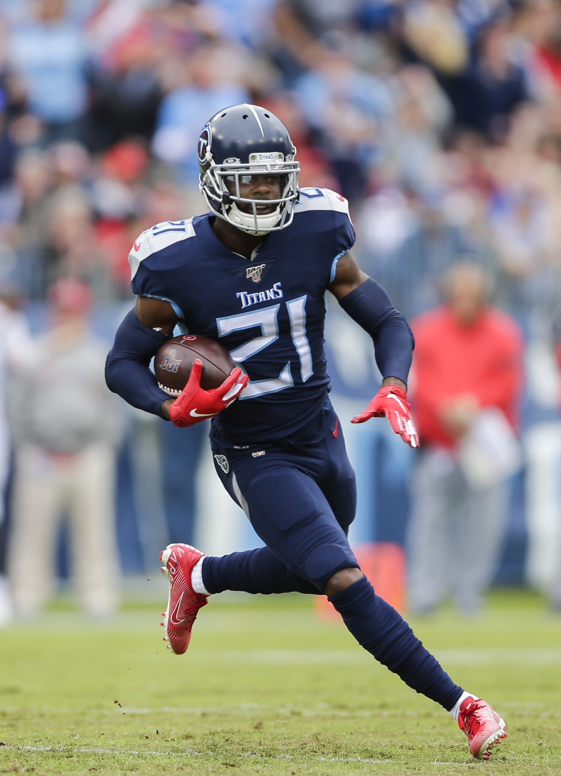 NASHVILLE, TENNESSEE - OCTOBER 27: Malcolm Butler #21 of the Tennessee Titans runs with the ball after making an interception during the first quarter of the game against the Tampa Bay Buccaneers at Nissan Stadium on October 27, 2019 in Nashville, Tennessee. (Photo by Silas Walker/Getty Images)