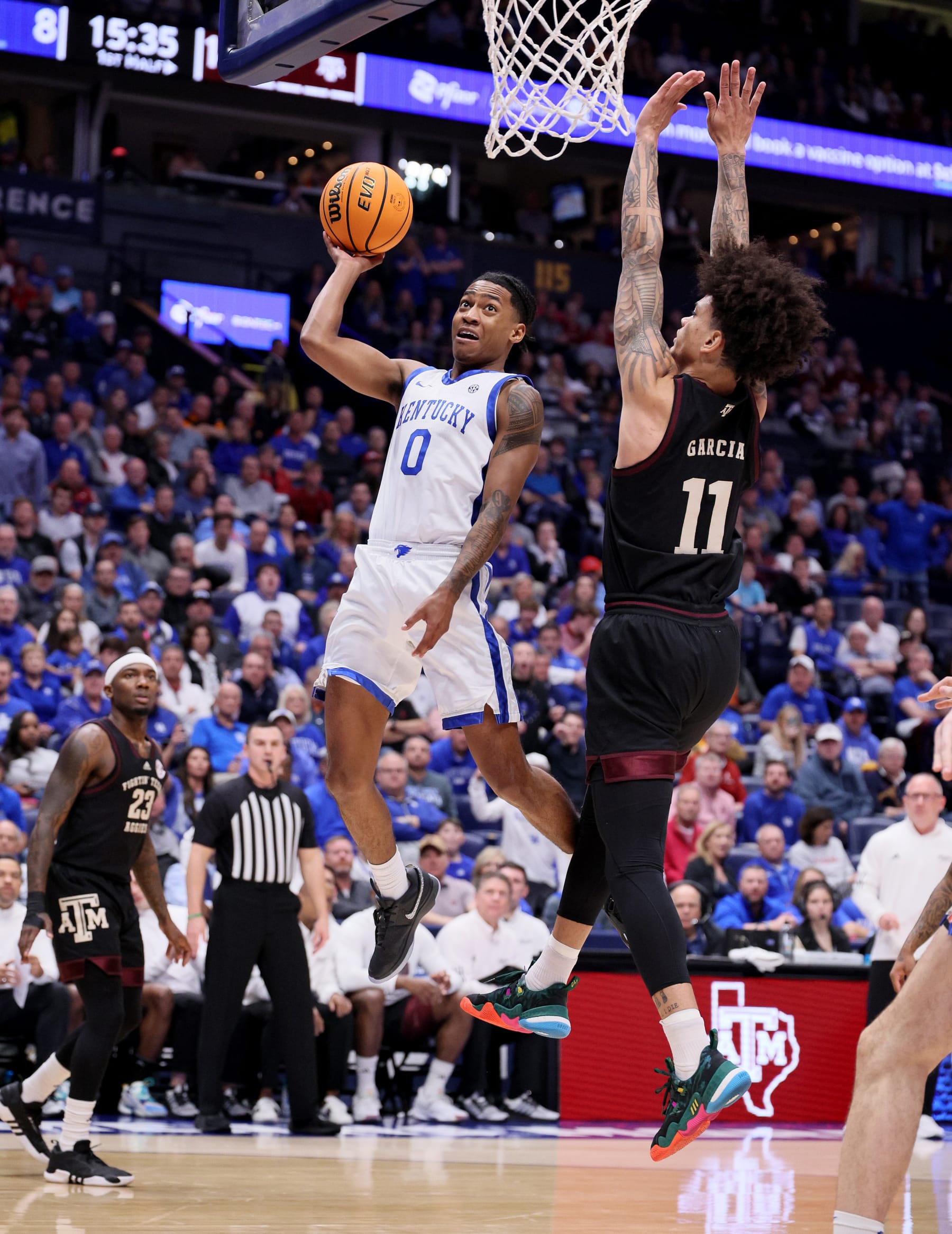 NASHVILLE, TENNESSEE - MARCH 15: Rob Dillingham #0 of the Kentucky Wildcats shoots the ball in the first half against the Texas A&M Aggies during the quarterfinals of the SEC Basketball Tournament at Bridgestone Arena on March 15, 2024 in Nashville, Tennessee. (Photo by Andy Lyons/Getty Images)