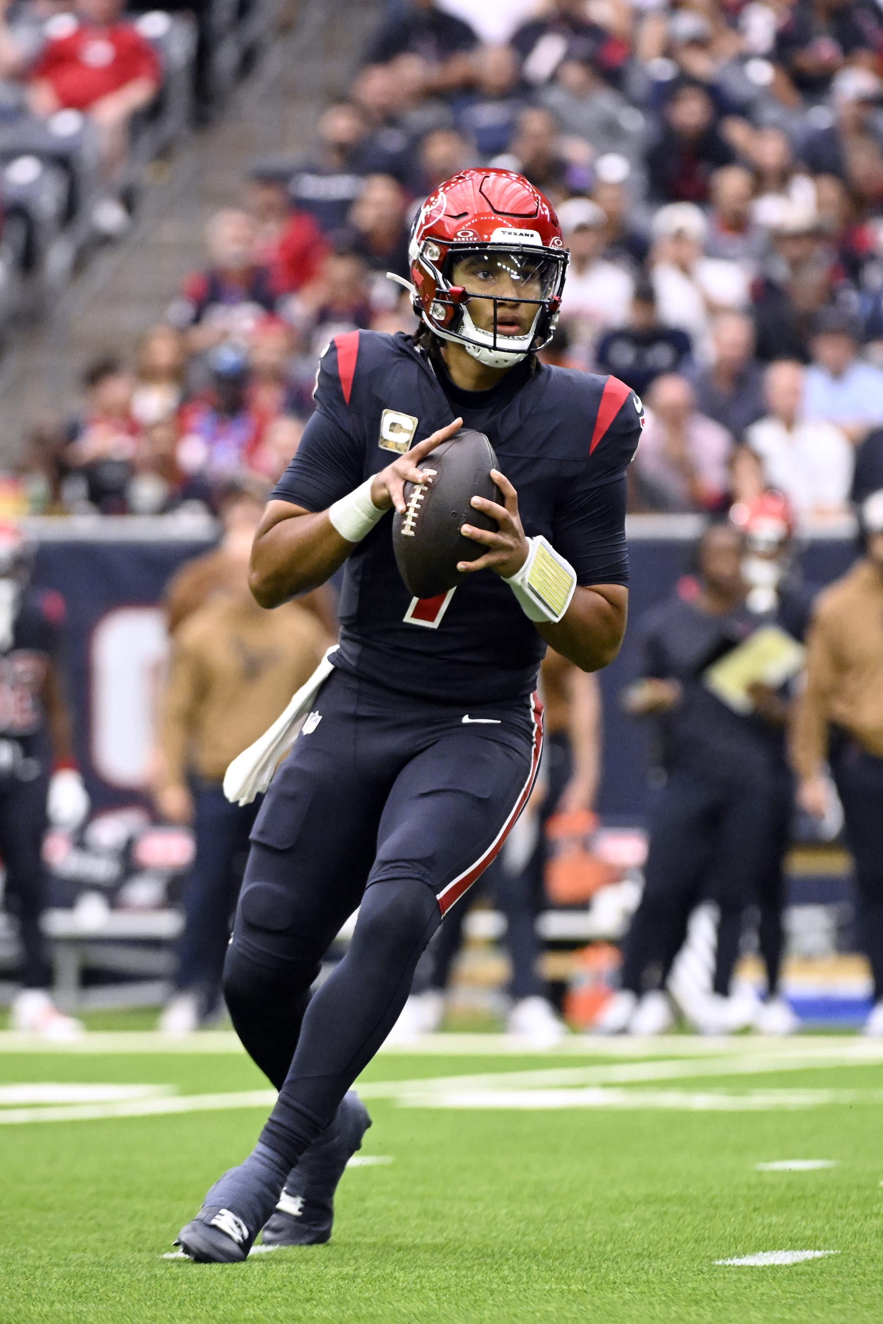 HOUSTON, TEXAS - NOVEMBER 19: C.J. Stroud #7 of the Houston Texans looks to pass during the first quarter of a game against the Arizona Cardinals at NRG Stadium on November 19, 2023 in Houston, Texas. (Photo by Logan Riely/Getty Images)