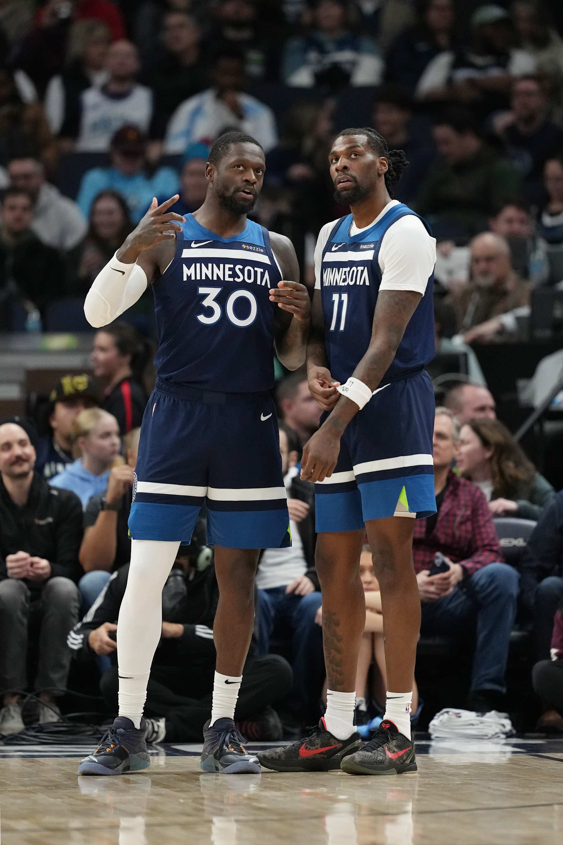 MINNEAPOLIS, MN -  DECEMBER 13: Julius Randle #30 and Naz Reid #11 of the Minnesota Timberwolves look on during the game against the Los Angeles Lakers on December 13, 2024 at Target Center in Minneapolis, Minnesota. NOTE TO USER: User expressly acknowledges and agrees that, by downloading and or using this Photograph, user is consenting to the terms and conditions of the Getty Images License Agreement. Mandatory Copyright Notice: Copyright 2024 NBAE (Photo by Jordan Johnson/NBAE via Getty Images)
