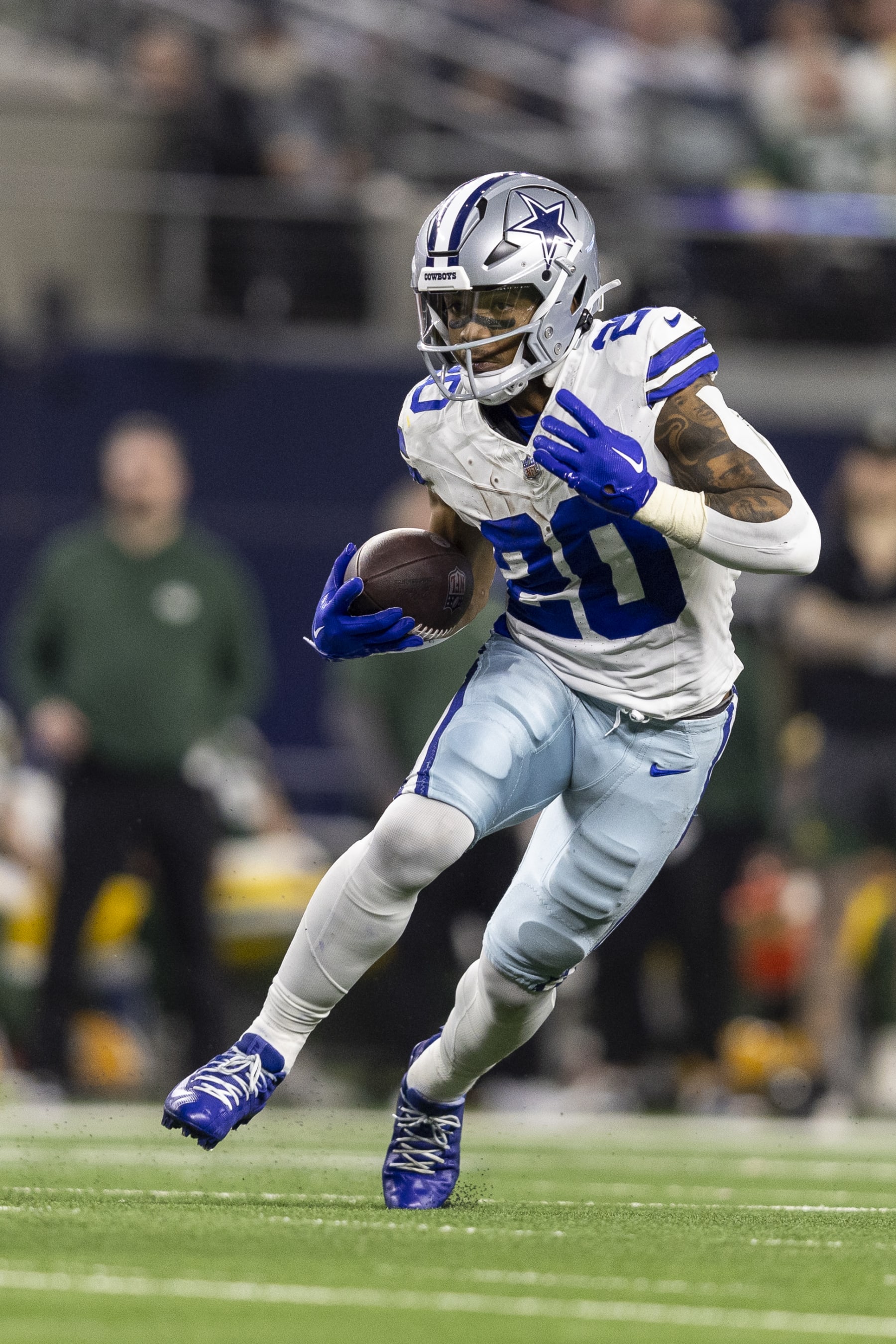 ARLINGTON, TEXAS - JANUARY 14: Tony Pollard #20 of the Dallas Cowboys runs with the ball during an NFL wild-card playoff football game between the Dallas Cowboys and the Green Bay Packers at AT&T Stadium on January 14, 2024 in Arlington, Texas. (Photo by Michael Owens/Getty Images) ARLINGTON, TEXAS - JANUARY 14: Tony Pollard #20 of the Dallas Cowboys runs with the ball during an NFL wild-card playoff football game between the Dallas Cowboys and the Green Bay Packers at AT&T Stadium on January 14, 2024 in Arlington, Texas. (Photo by Michael Owens/Getty Images)