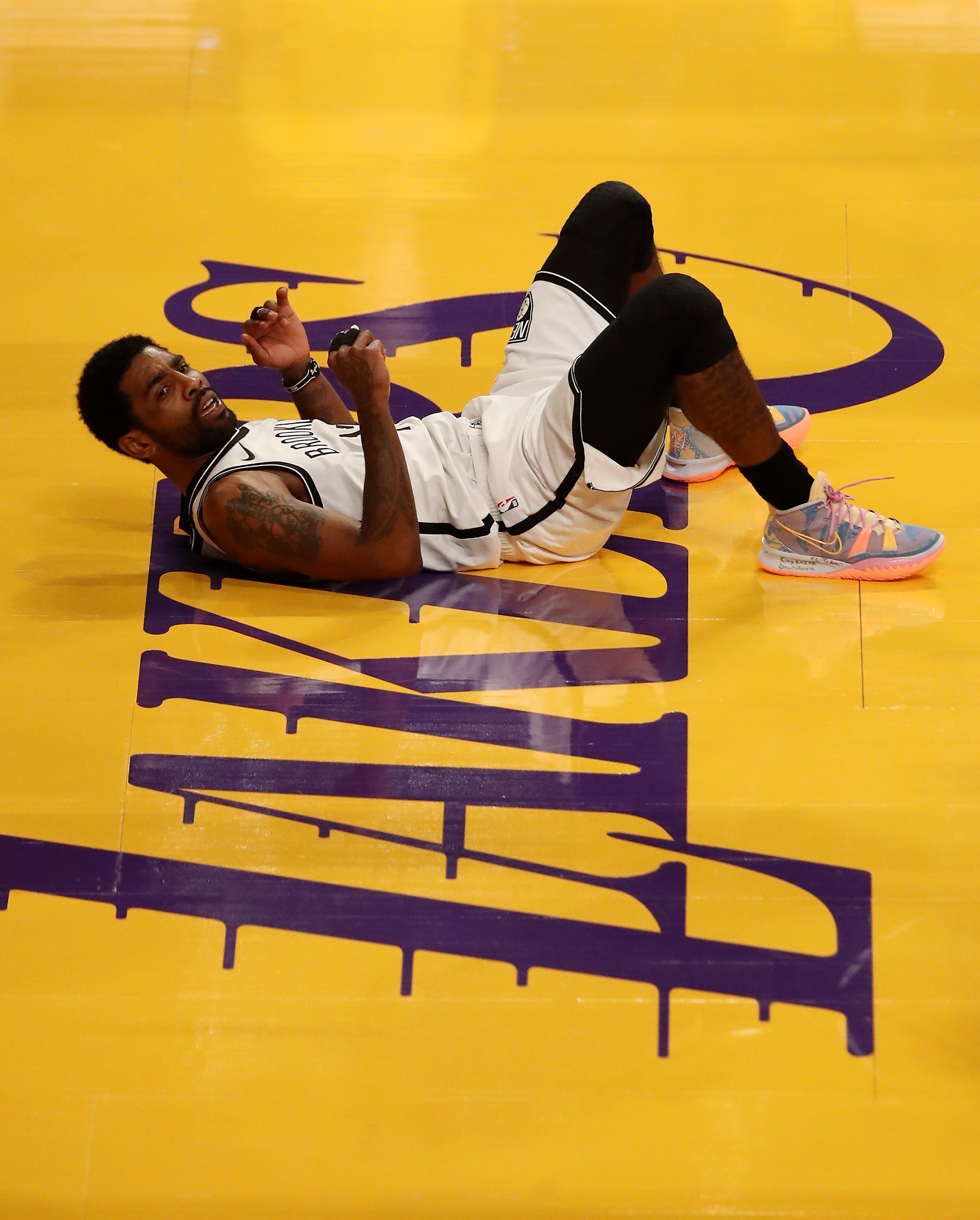 LOS ANGELES, CALIFORNIA - FEBRUARY 18: Kyrie Irving #11 of the Brooklyn Nets reacts to a play during the third quarter against the Los Angeles Lakers at Staples Center on February 18, 2021 in Los Angeles, California. NOTE TO USER: User expressly acknowledges and agrees that, by downloading and or using this photograph, User is consenting to the terms and conditions of the Getty Images License Agreement. (Photo by Katelyn Mulcahy/Getty Images)