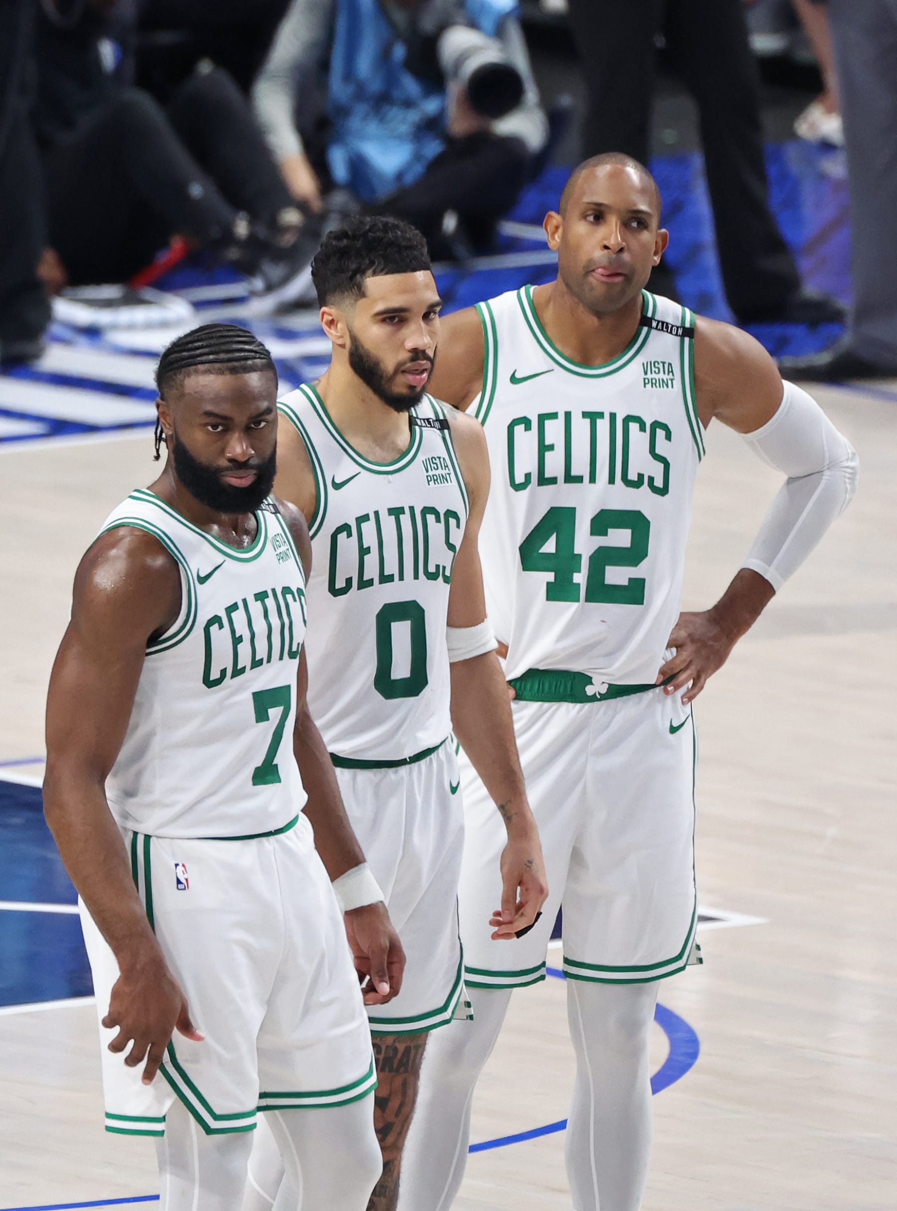 DALLAS, TX - JUNE 12: Jaylen Brown #7, Jayson Tatum #0 and Al Horford #42 of the Boston Celtics look on during the game against the Dallas Mavericks during Game 3 of the 2024 NBA Finals on June 12, 2024 at the American Airlines Center in Dallas, Texas. NOTE TO USER: User expressly acknowledges and agrees that, by downloading and or using this photograph, User is consenting to the terms and conditions of the Getty Images License Agreement. Mandatory Copyright Notice: Copyright 2024 NBAE (Photo by Joe Murphy/NBAE via Getty Images)