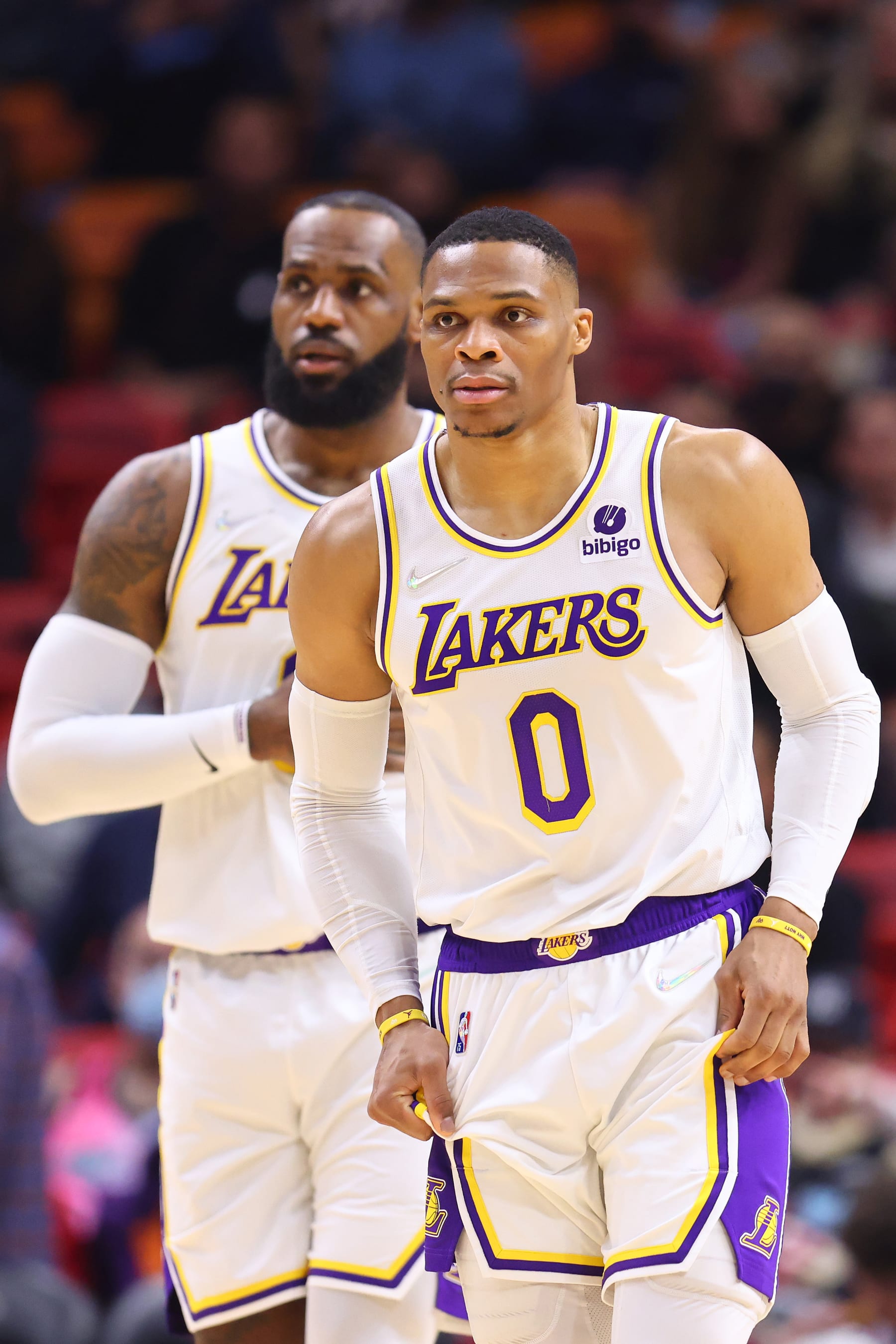 MIAMI, FLORIDA - JANUARY 23: LeBron James #6 and Russell Westbrook #0 of the Los Angeles Lakers look on against the Miami Heat at FTX Arena on January 23, 2022 in Miami, Florida. NOTE TO USER: User expressly acknowledges and agrees that, by downloading and or using this photograph, User is consenting to the terms and conditions of the Getty Images License Agreement.  (Photo by Michael Reaves/Getty Images)