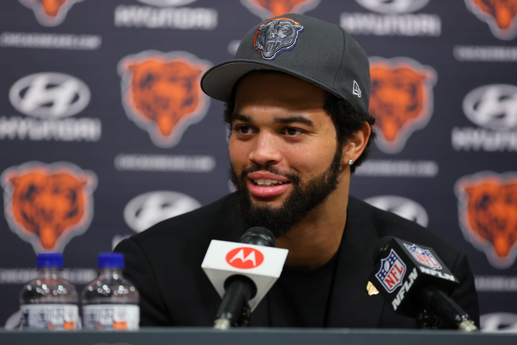 LAKE FOREST, ILLINOIS - APRIL 26: Caleb Williams #18 of the Chicago Bears speaks answers a question from the media during his introductory press conference at Halas Hall on April 26, 2024 in Lake Forest, Illinois. Caleb Williams was drafted first overall in the 2024 NFL Draft on Thursday. (Photo by Michael Reaves/Getty Images)