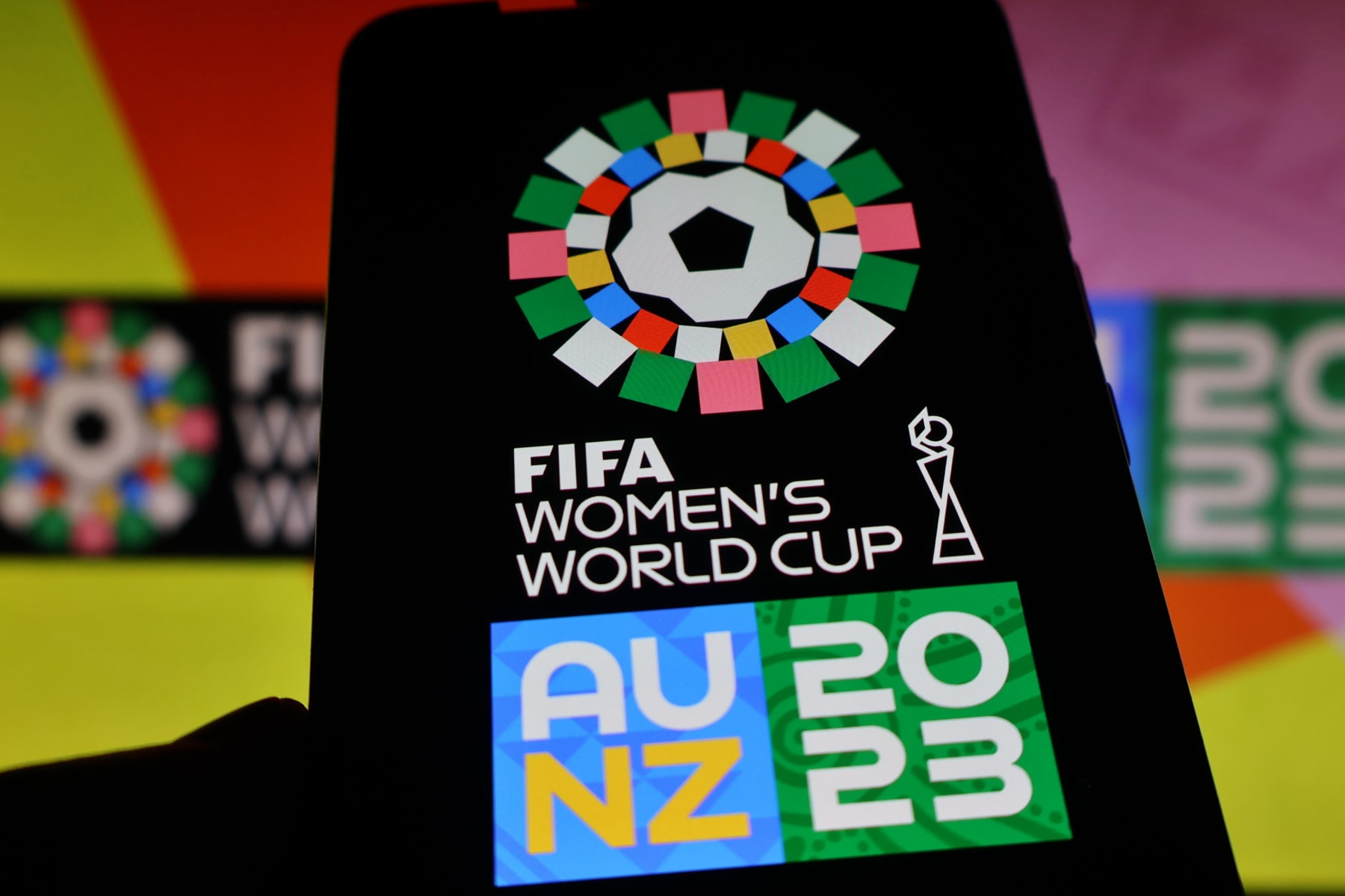 UKRAINE - 2023/07/03: In this photo illustration, a 2023 FIFA Women's World Cup logo seen displayed on a smartphone. The 2023 FIFA Women's World Cup will be the ninth edition of the FIFA Women's World Cup. The tournament will be jointly hosted by Australia and New Zealand, and is scheduled to take place from 20 July to 20 August 2023. (Photo Illustration by Aleksandr Gusev/SOPA Images/LightRocket via Getty Images)