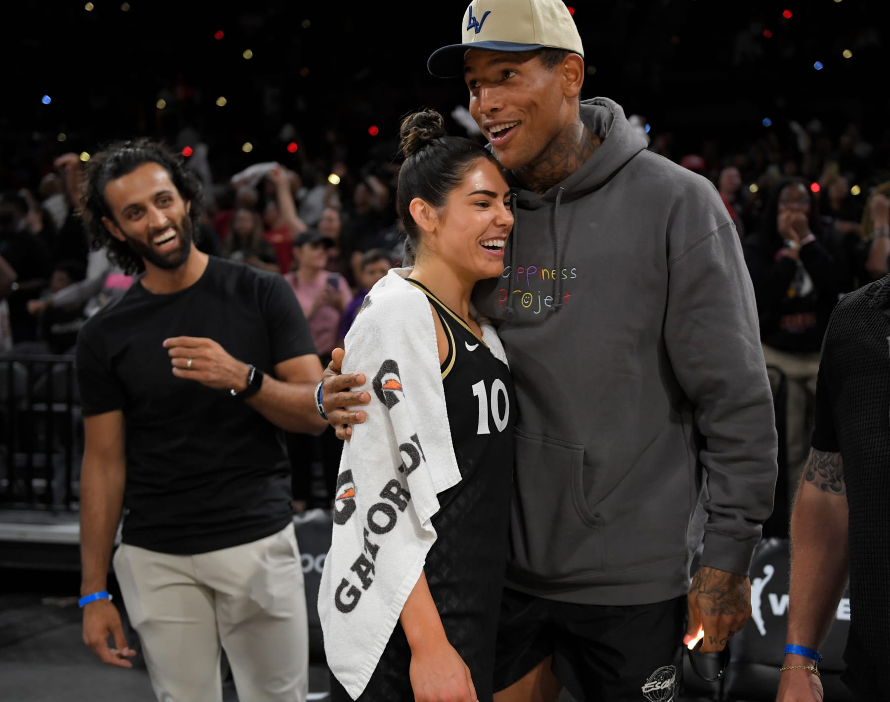 LAS VEGAS, NV - AUGUST 17: NFL player, Darren Waller embraces Kelsey Plum #10 of the Las Vegas Aces after Round 1 Game 1 of the 2022 WNBA Playoffs on August 17, 2022 at Michelob ULTRA Arena in Las Vegas, Nevada. NOTE TO USER: User expressly acknowledges and agrees that, by downloading and or using this photograph, User is consenting to the terms and conditions of the Getty Images License Agreement. Mandatory Copyright Notice: Copyright 2022 NBAE (Photo by David Becker/NBAE via Getty Images)