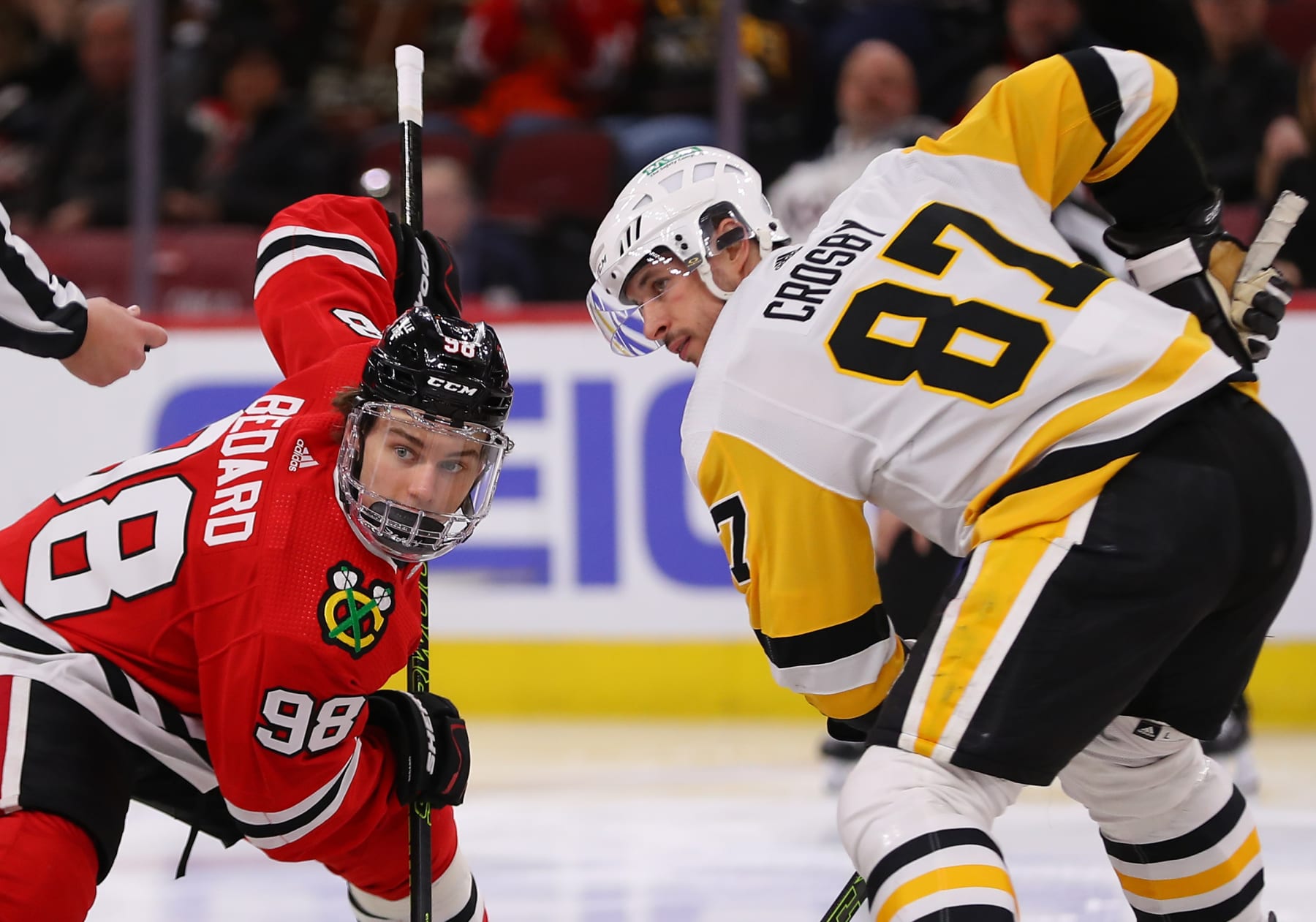 CHICAGO, IL - FEBRUARY 15: Sidney Crosby #87 of the Pittsburgh Penguins and Connor Bedard #98 of the Chicago Blackhawks look on during a face-off during the third period at the United Center on February 15, 2024 in Chicago, Illinois. (Photo by Melissa Tamez/Icon Sportswire via Getty Images)