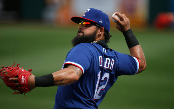 SURPRISE, ARIZONA - MARCH 07: Rougned Odor #12 of the Texas Rangers warms up prior to the MLB spring training baseball game against the Los Angeles Dodgers at Surprise Stadium on March 07, 2021 in Surprise, Arizona. (Photo by Ralph Freso/Getty Images)