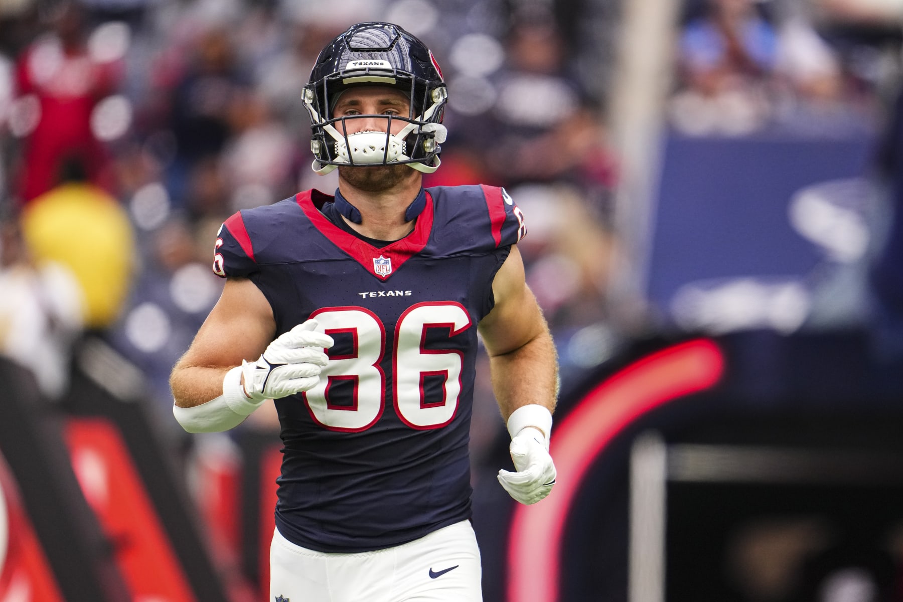 HOUSTON, TX - OCTOBER 15: Dalton Schultz #86 of the Houston Texans runs out of the tunnel prior to an NFL football game against the New Orleans Saints at NRG Stadium on October 15, 2023 in Houston, Texas. (Photo by Cooper Neill/Getty Images)