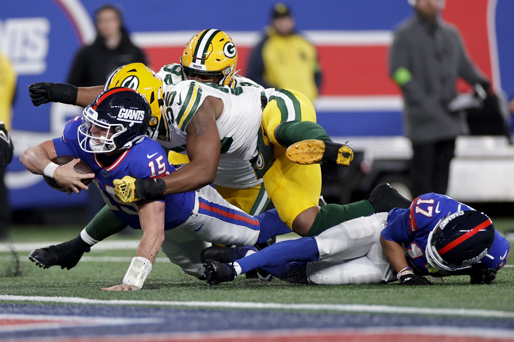 New York Giants quarterback Tommy DeVito (15) is brought down just shy of the goal line by Green Bay Packers linebacker Kingsley Enagbare (55) during the third quarter of an NFL football game, Monday, Dec. 11, 2023, in East Rutherford, N.J. (AP Photo/Adam Hunger)