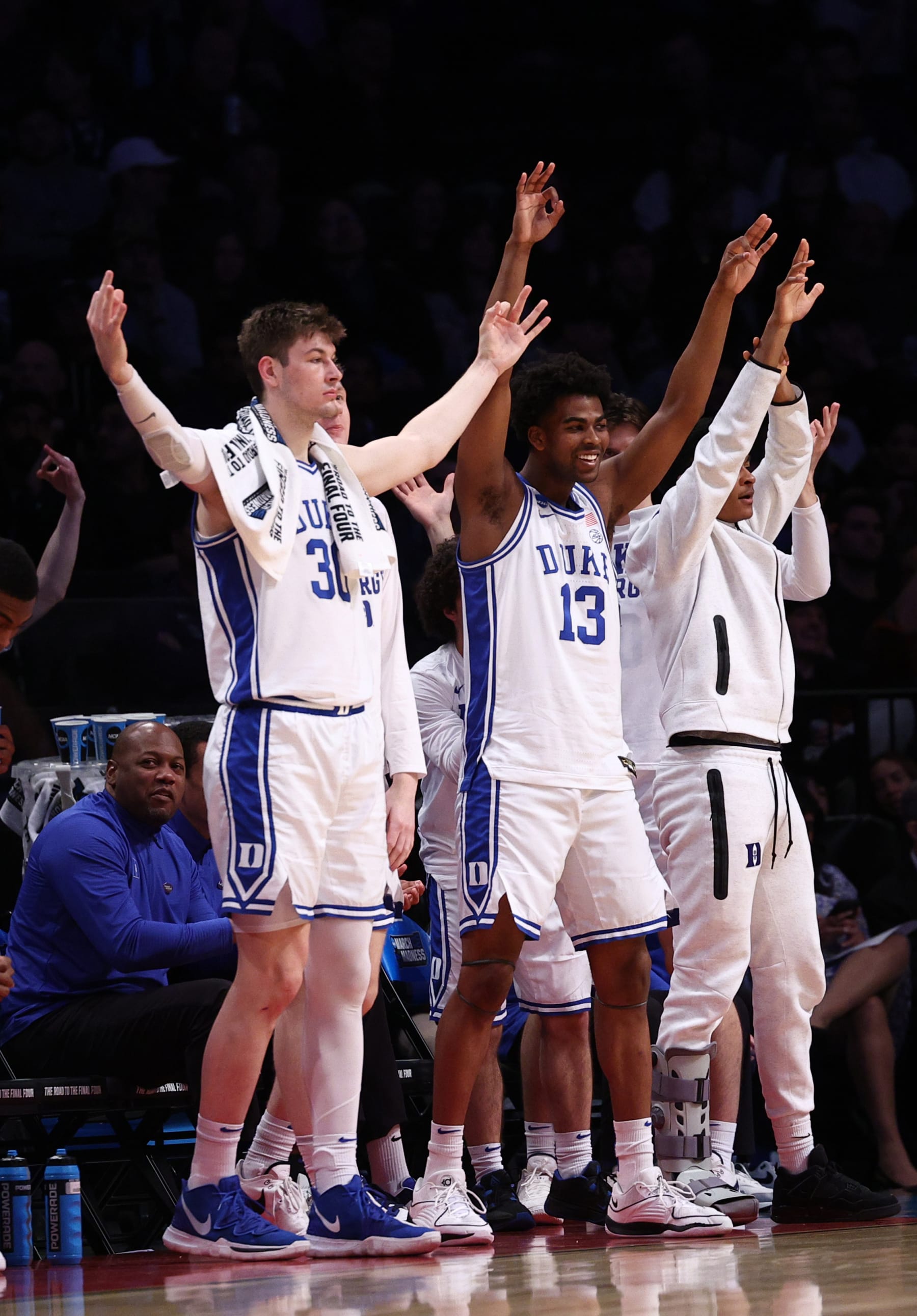 NEW YORK, NEW YORK - MARCH 24: Kyle Filipowski #30 and Sean Stewart #13 of the Duke Blue Devils react on the bench during the first half against the James Madison Dukes in the second round of the NCAA Men's Basketball Tournament at Barclays Center on March 24, 2024 in New York City. (Photo by Elsa/Getty Images)