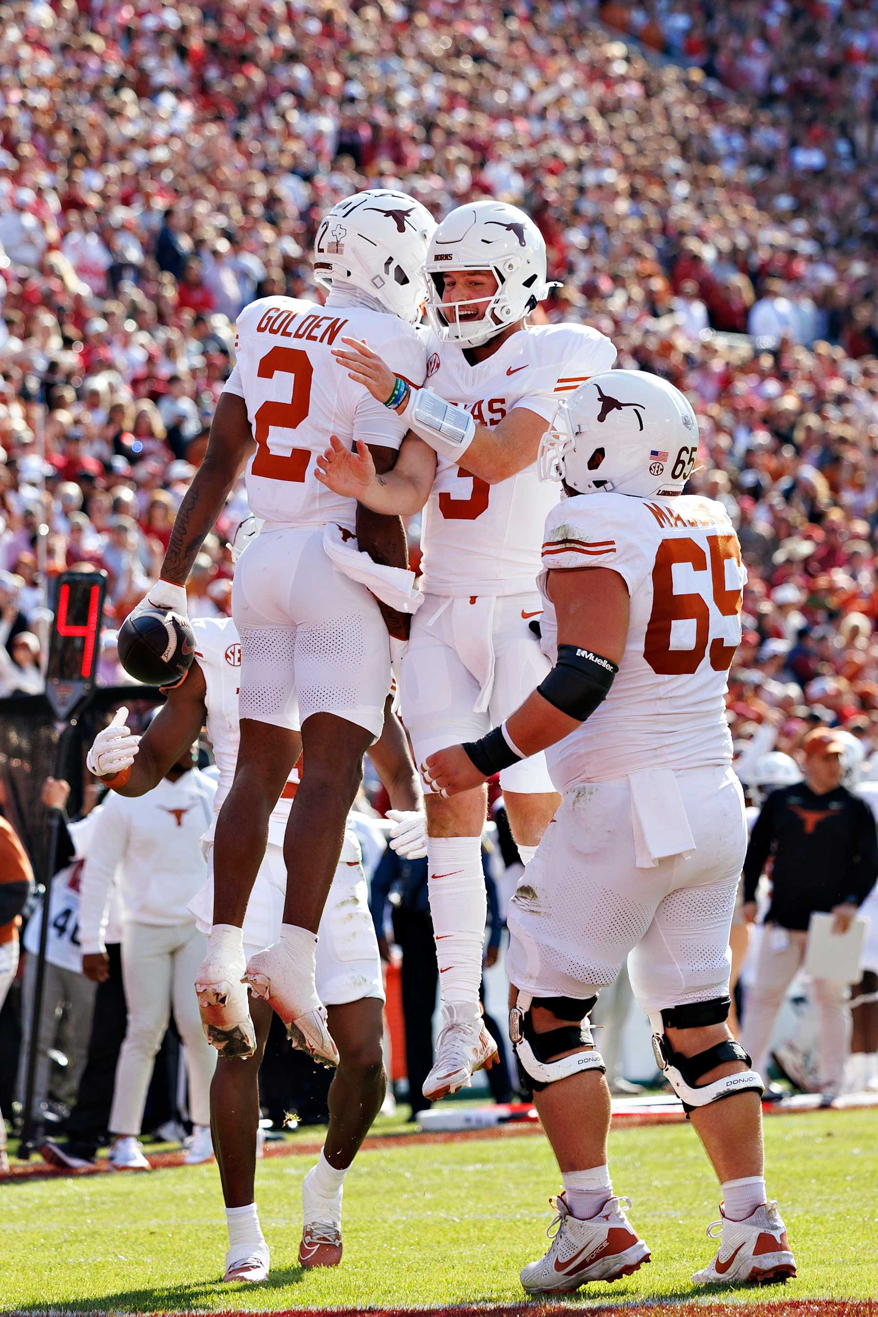 FAYETTEVILLE, ARKANSAS - NOVEMBER 16: Quinn Ewers #3 and Matthew Golden #2 of the Texas Longhorns celebrate after a touchdown in the first half during a game against the Arkansas Razorbacks at Donald W. Reynolds Razorback Stadium on November 16, 2024 in Fayetteville, Arkansas. (Photo by Wesley Hitt/Getty Images)