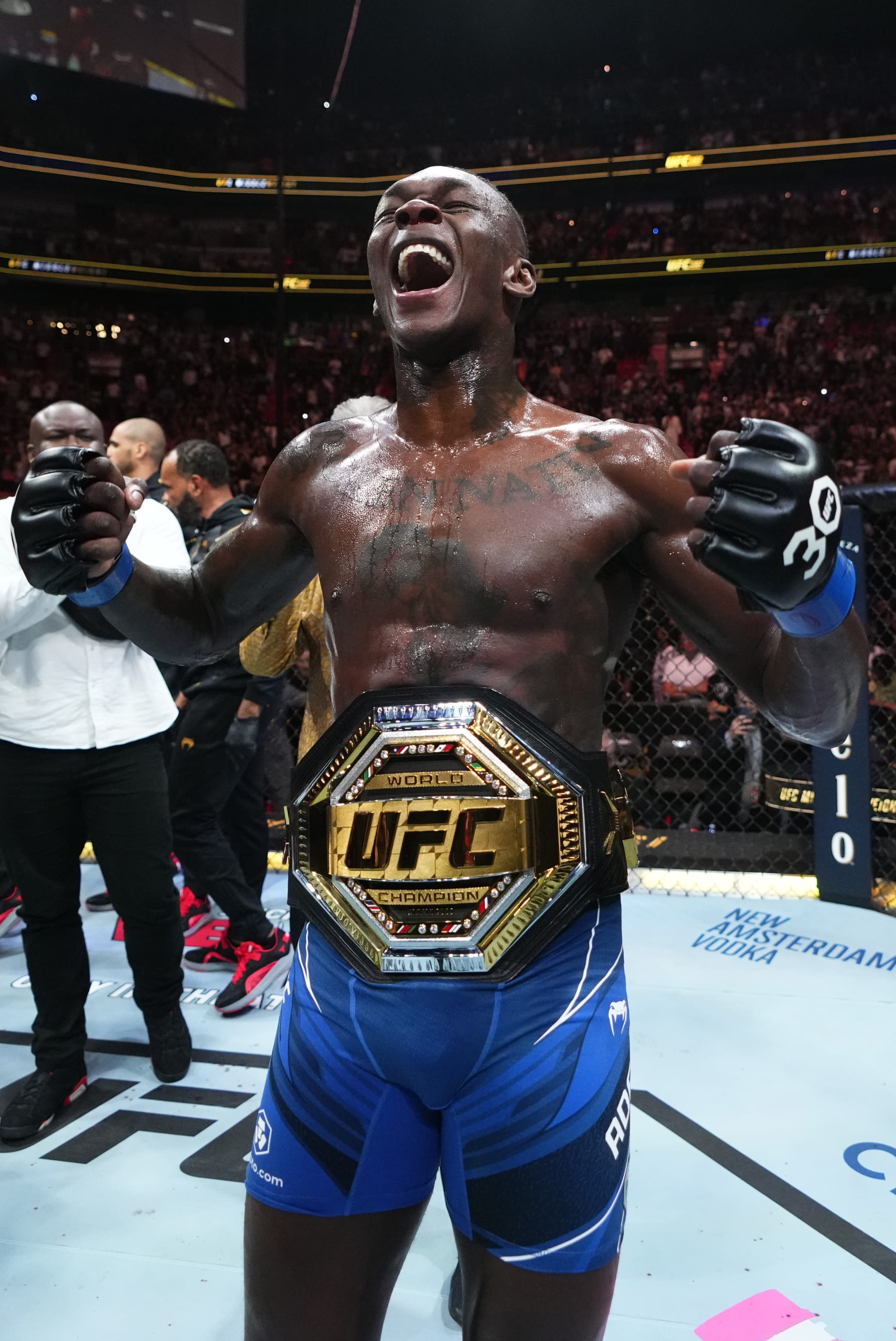MIAMI, FLORIDA - APRIL 08: Israel Adesanya of Nigeria reacts after knocking out Alex Pereira of Brazil in the UFC middleweight championship fight during the UFC 287 event at Kaseya Center on April 08, 2023 in Miami, Florida. (Photo by Jeff Bottari/Zuffa LLC via Getty Images)