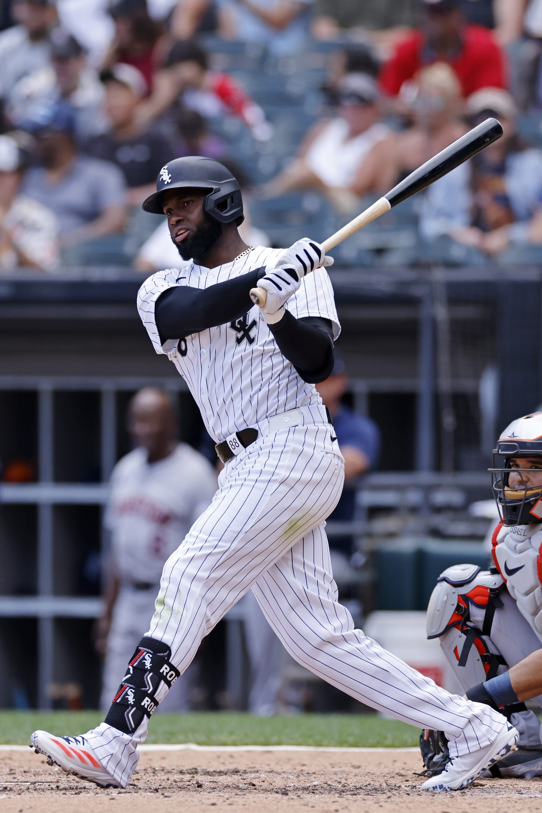 CHICAGO, IL - JUNE 20: Chicago White Sox outfielder Luis Robert Jr. (88) doubles to left field to drive in the tying run in the fifth inning during an MLB game against the Houston Astros on June 20, 2024 at Guaranteed Rate Field in Chicago, Illinois. (Photo by Joe Robbins/Icon Sportswire via Getty Images)