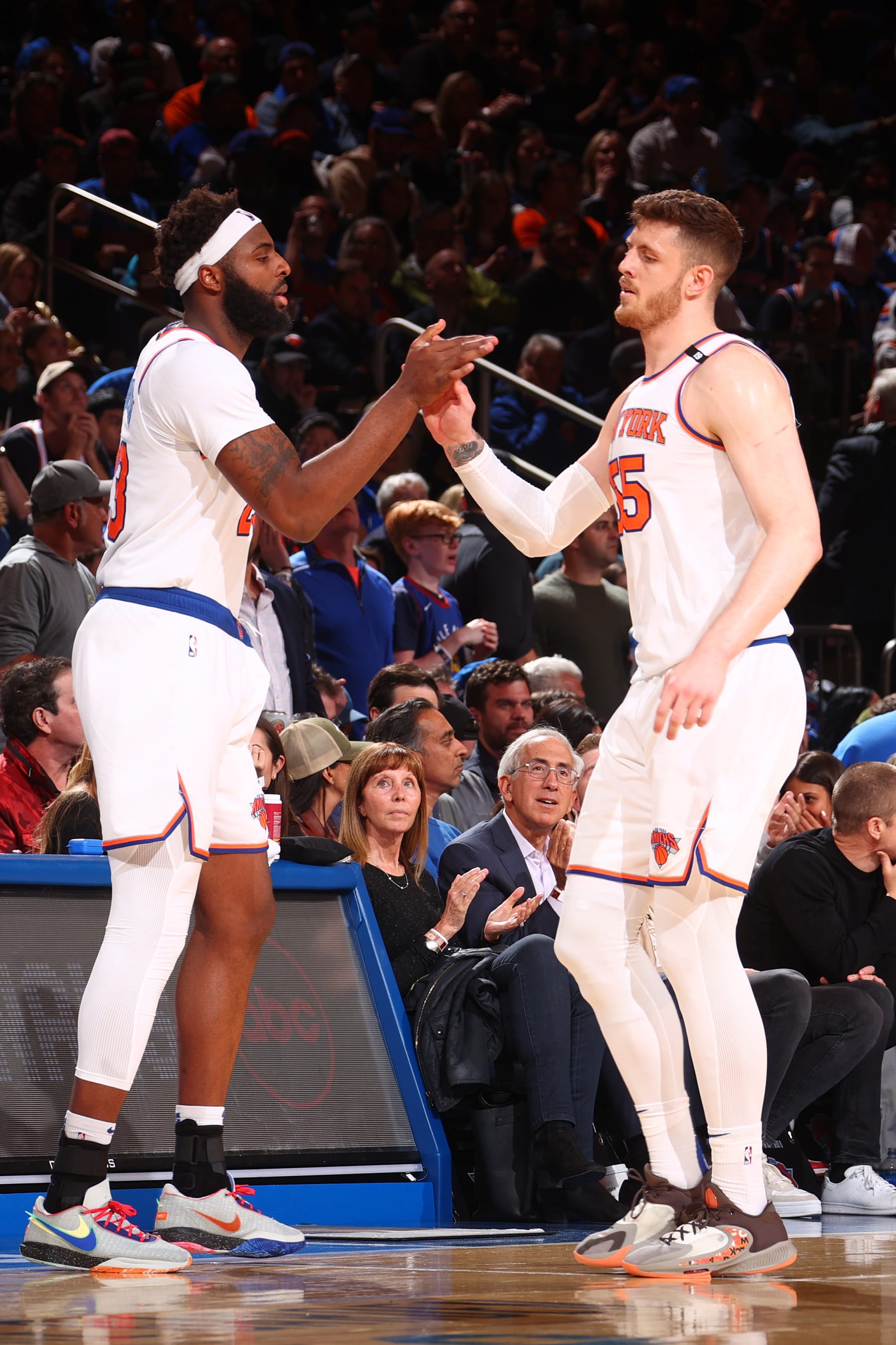 NEW YORK, NY - APRIL 21: Isaiah Hartenstein #55 high fives Mitchell Robinson #23 of the New York Knicks during the game against the Cleveland Cavaliers on April 21, 2023 at Madison Square Garden in New York City, New York.  NOTE TO USER: User expressly acknowledges and agrees that, by downloading and or using this photograph, User is consenting to the terms and conditions of the Getty Images License Agreement. Mandatory Copyright Notice: Copyright 2023 NBAE  (Photo by Nathaniel S. Butler/NBAE via Getty Images)