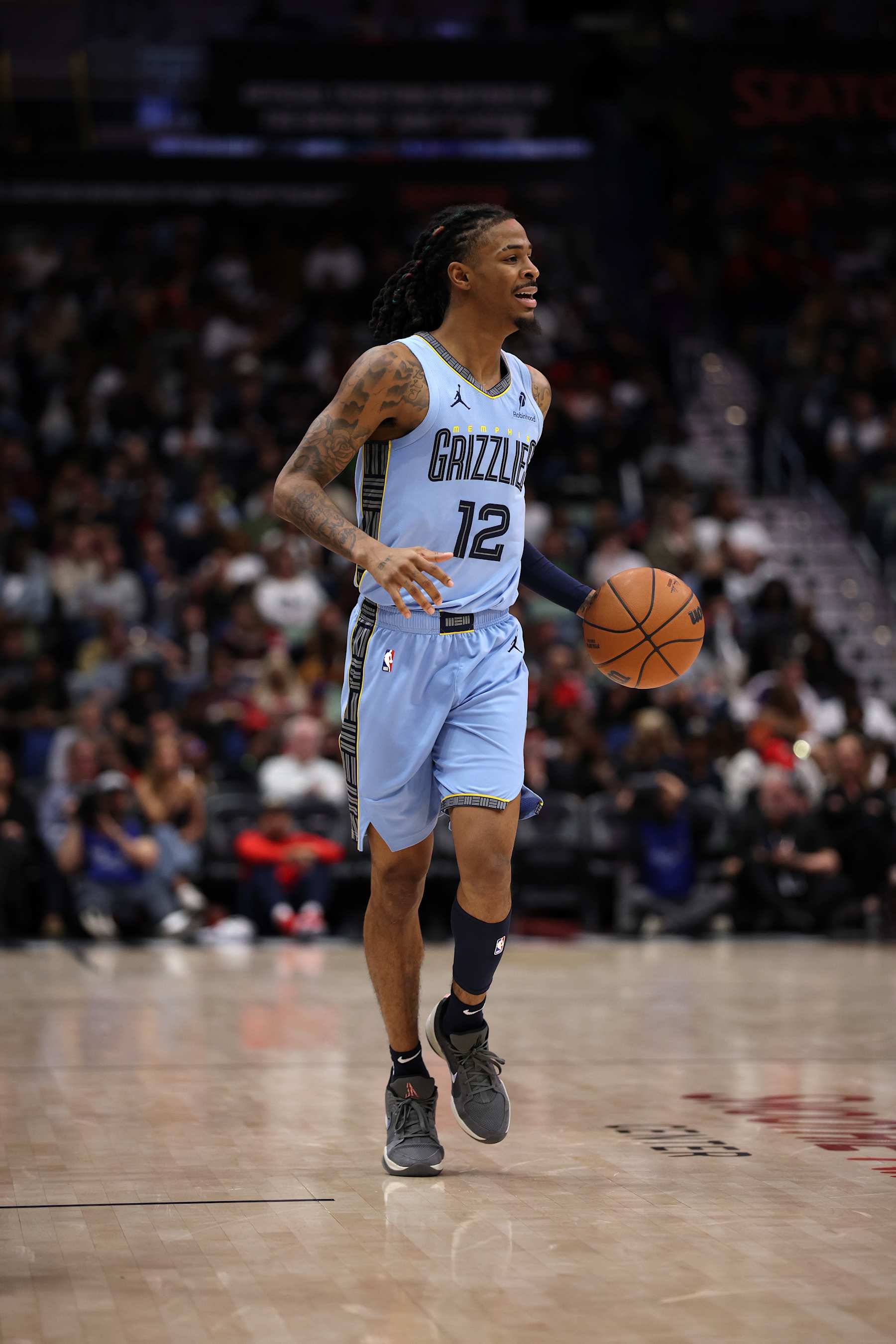 NEW ORLEANS, LOUISIANA - DECEMBER 27: Ja Morant #12 of the Memphis Grizzlies in action against the New Orleans Pelicans at Smoothie King Center on December 27, 2024 in New Orleans, Louisiana. NOTE TO USER: User expressly acknowledges and agrees that, by downloading and or using this photograph, User is consenting to the terms and conditions of the Getty Images License Agreement. (Photo by Chris Graythen/Getty Images)