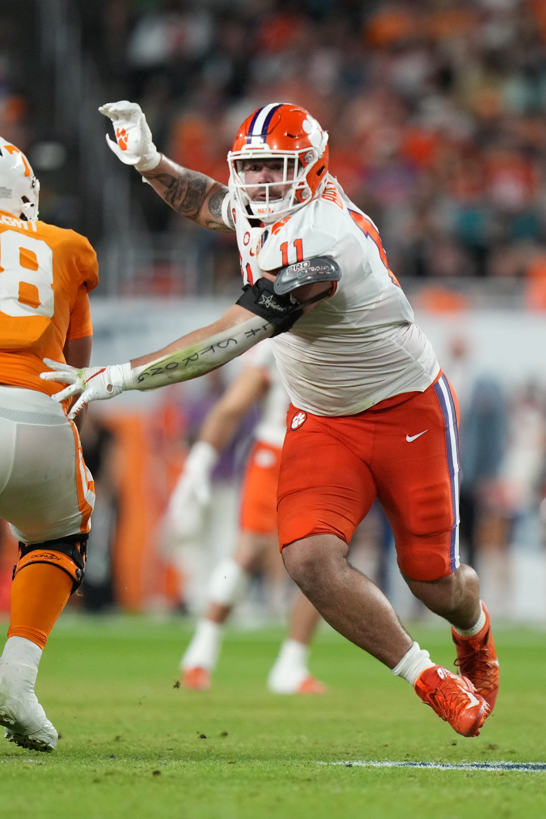 MIAMI GARDENS, FL - DECEMBER 30: Clemson Tigers defensive tackle Bryan Bresee (11) jukes past a lineman as he rushes the pocket during the Capital One Orange Bowl game between the Tennessee Volunteers and the Clemson Tigers on Friday, December 20, 2022 at Hard Rock Stadium, Miami Gardens, Fla. (Photo by Peter Joneleit/Icon Sportswire via Getty Images)