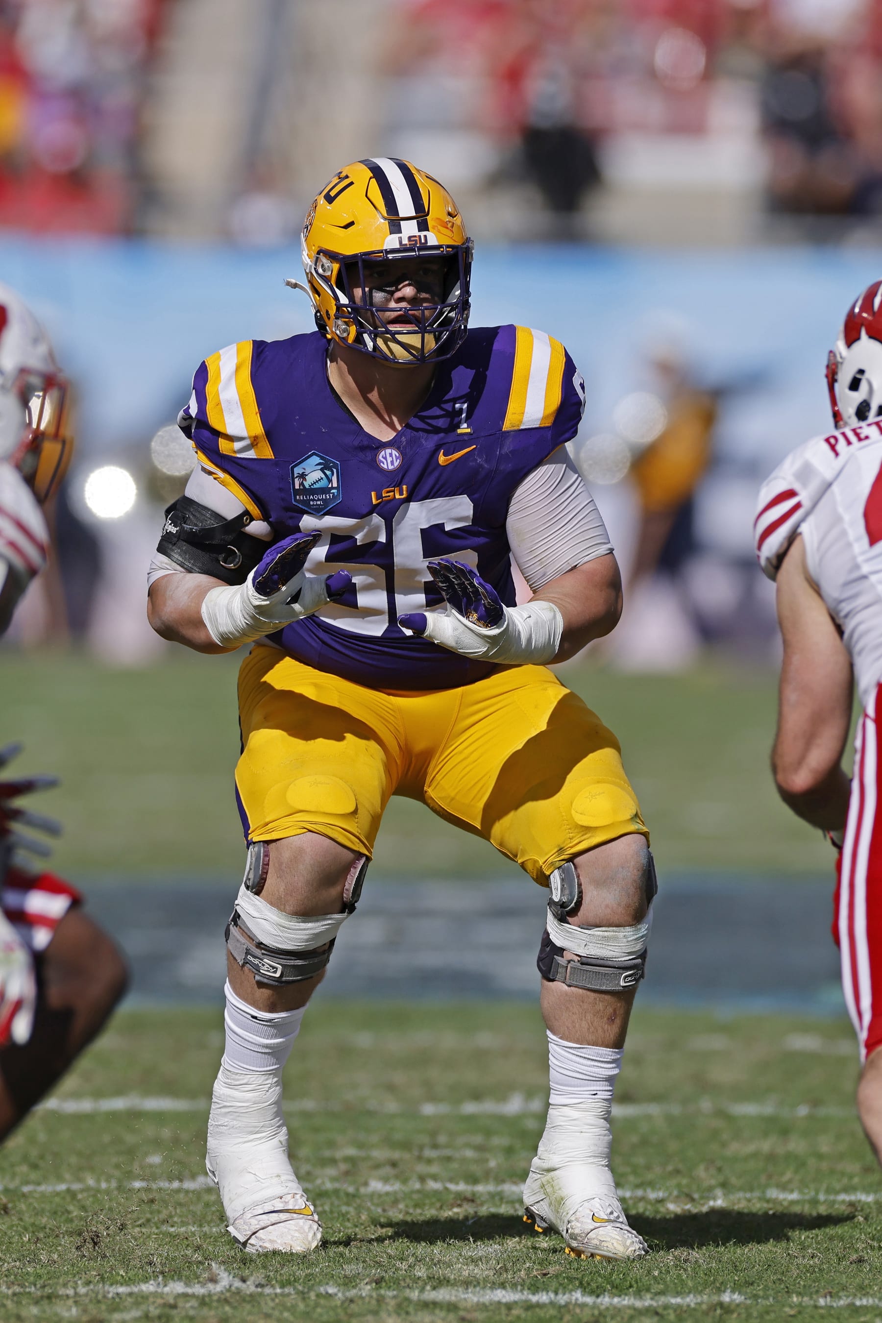TAMPA, FL - JANUARY 01: LSU Tigers offensive lineman Will Campbell (66) blocks during the ReliaQuest Bowl against the Wisconsin Badgers on January 1, 2024 at Raymond James Stadium in Tampa, Florida. (Photo by Joe Robbins/Icon Sportswire via Getty Images)
