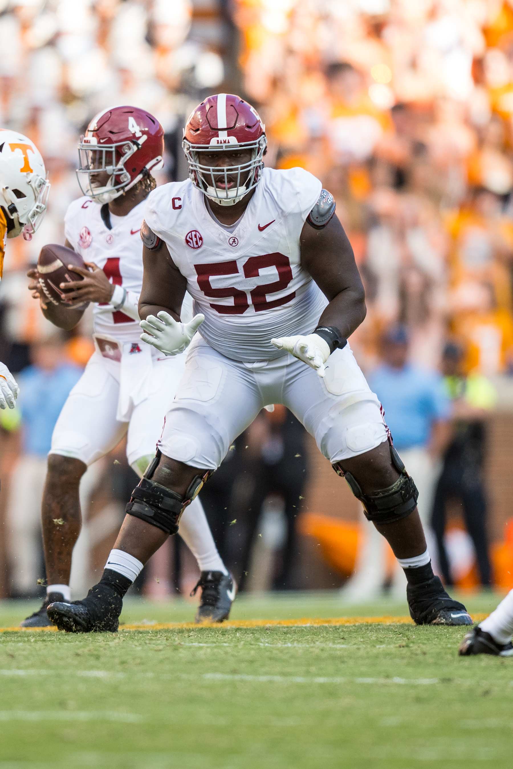 KNOXVILLE, TN - OCTOBER 19: Alabama Crimson Tide offensive lineman Tyler Booker (52) blocks during the college football game between the Tennessee Volunteers and the Alabama Crimson Tide on October 19, 2024, at Neyland Stadium in Knoxville, TN. (Photo by Bryan Lynn/Icon Sportswire via Getty Images)