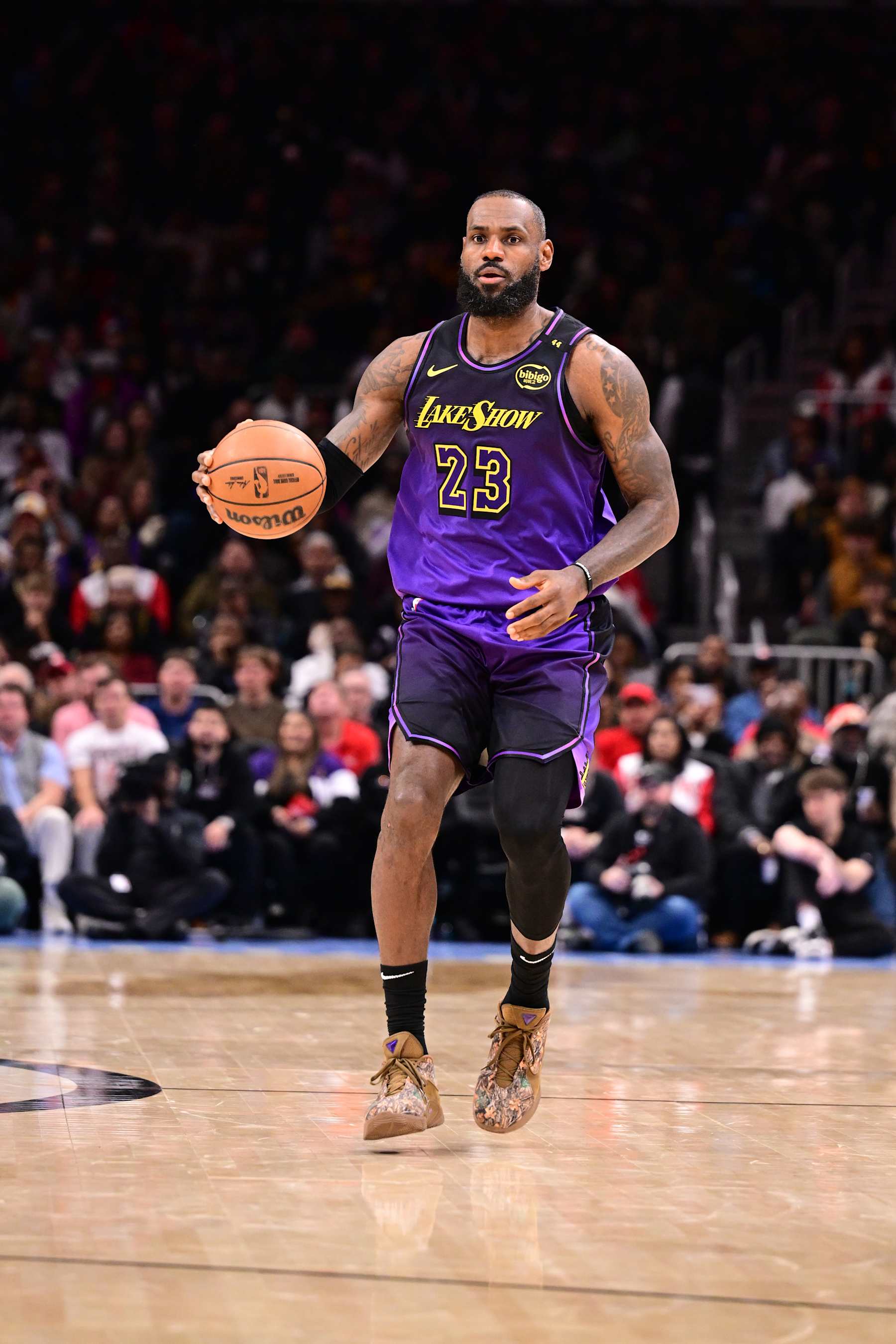ATLANTA, GA - DECEMBER 6: LeBron James #23 of the Los Angeles Lakers dribbles the ball during the game against the Atlanta Hawks on December 6, 2024 at State Farm Arena in Atlanta, Georgia.  NOTE TO USER: User expressly acknowledges and agrees that, by downloading and/or using this Photograph, user is consenting to the terms and conditions of the Getty Images License Agreement. Mandatory Copyright Notice: Copyright 2024 NBAE (Photo by Adam Hagy/NBAE via Getty Images)