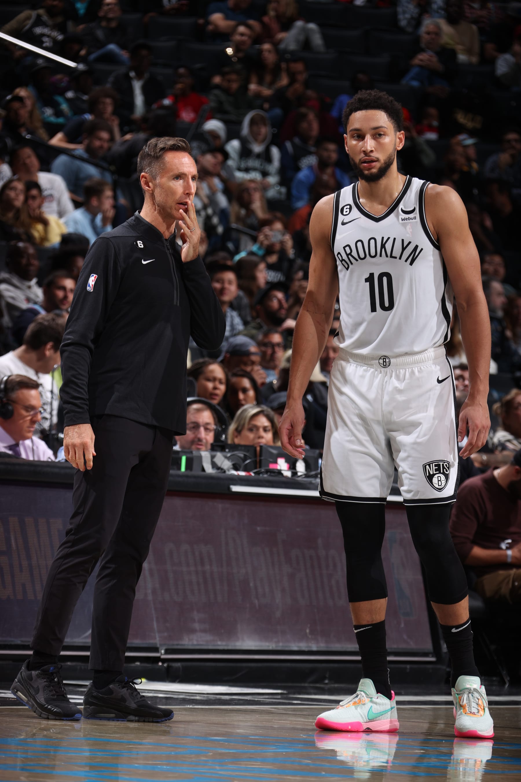BROOKLYN, NY - OCTOBER 6:  Head Coach Steve Nash speaks with Ben Simmons #10 of the Brooklyn Nets during the game against the Miami Heat  on October 6, 2022 at Barclays Center in Brooklyn, New York. NOTE TO USER: User expressly acknowledges and agrees that, by downloading and or using this Photograph, user is consenting to the terms and conditions of the Getty Images License Agreement. Mandatory Copyright Notice: Copyright 2022 NBAE (Photo by Nathaniel S. Butler/NBAE via Getty Images)