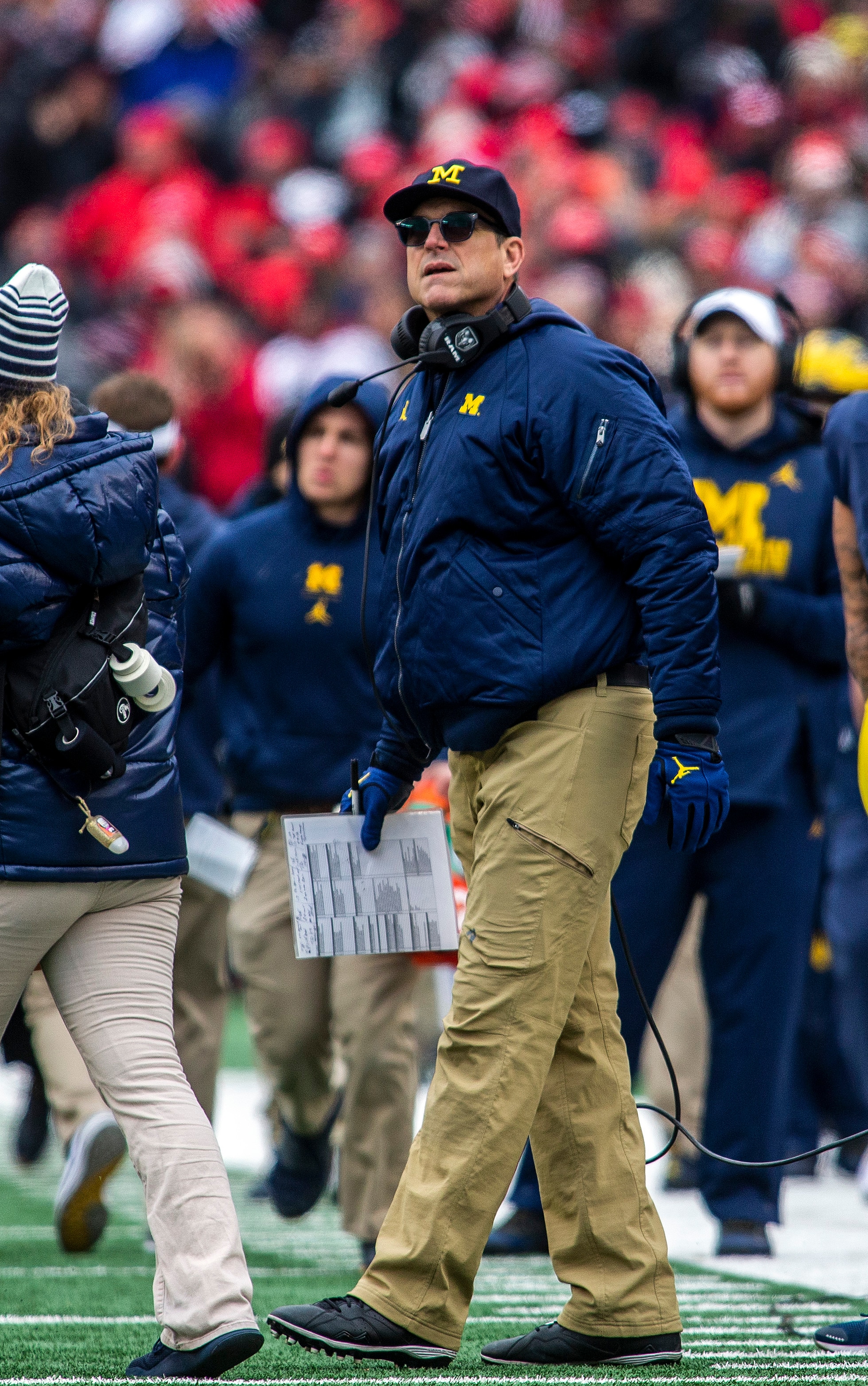 Michigan head coach Jim Harbaugh looks up at the scoreboard during a media timeout in the second quarter of an NCAA college football game against Ohio State in Ann Arbor, Mich., Saturday, Nov. 30, 2019. (AP Photo/Tony Ding)