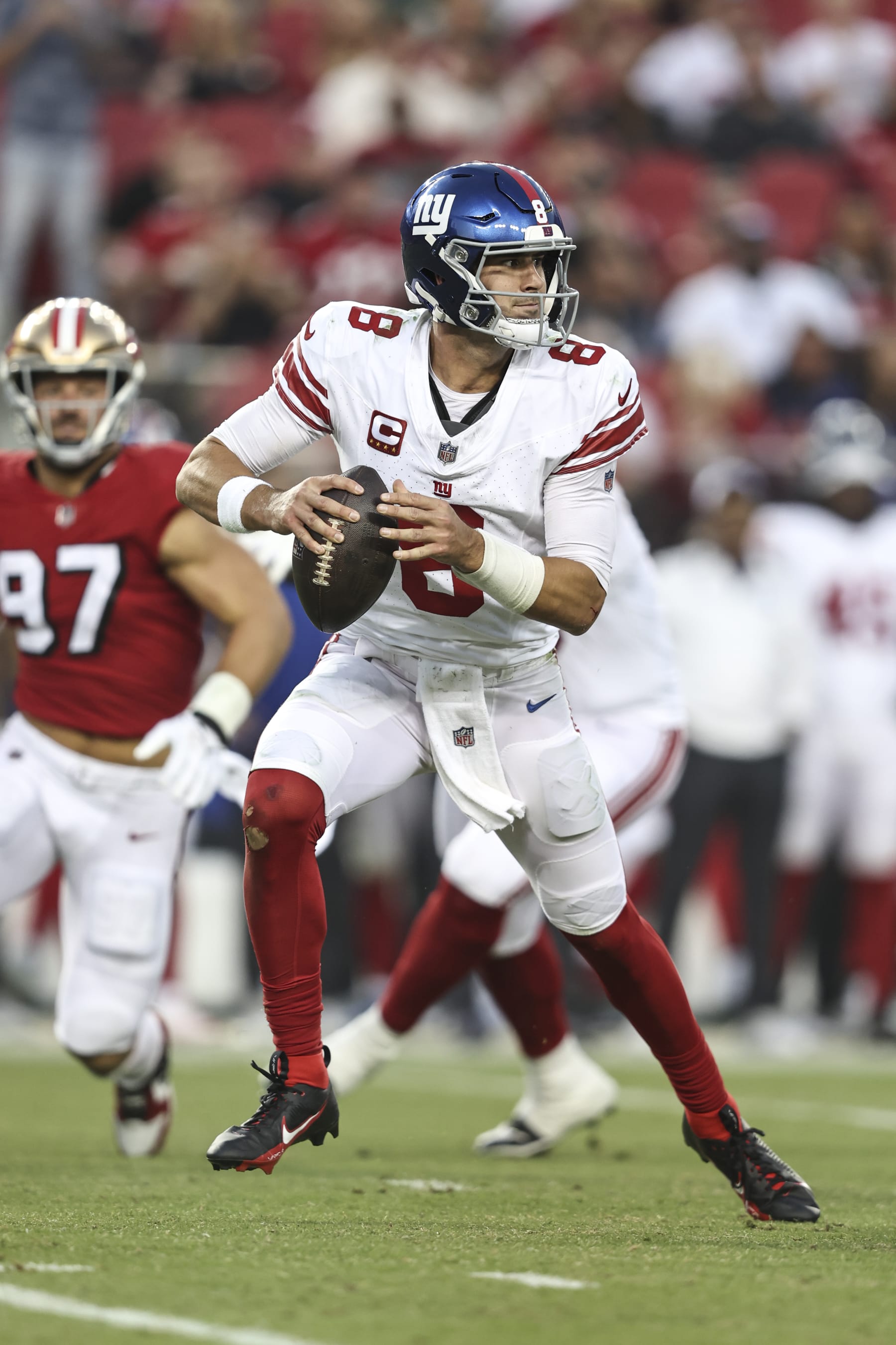 SANTA CLARA, CALIFORNIA - SEPTEMBER 21: Daniel Jones #8 of the New York Giants scrambles and looks to pass during an NFL football game between the San Francisco 49ers and the New York Giants at Levi's Stadium on September 21, 2023 in Santa Clara, California. (Photo by Michael Owens/Getty Images) SANTA CLARA, CALIFORNIA - SEPTEMBER 21: Daniel Jones #8 of the New York Giants scrambles and looks to pass during an NFL football game between the San Francisco 49ers and the New York Giants at Levi's Stadium on September 21, 2023 in Santa Clara, California. (Photo by Michael Owens/Getty Images)