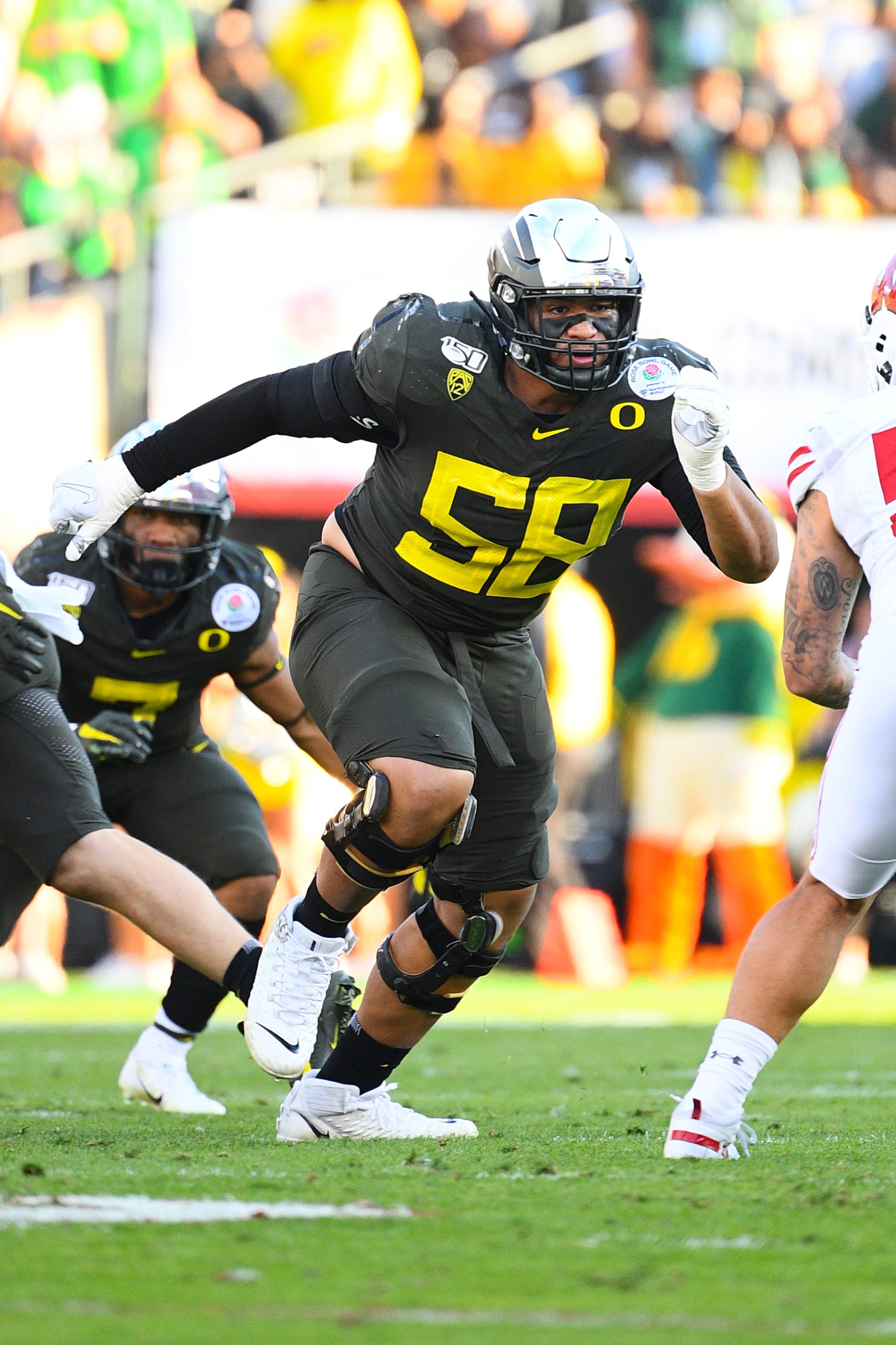 PASADENA, CA - JANUARY 01: Oregon Ducks (58) Penei Sewell (OL) gets ready to block during the Rose Bowl game between the Wisconsin Badgers and the Oregon Ducks on January 1, 2020 at the Rose Bowl in Pasadena, CA. (Photo by Brian Rothmuller/Icon Sportswire via Getty Images)