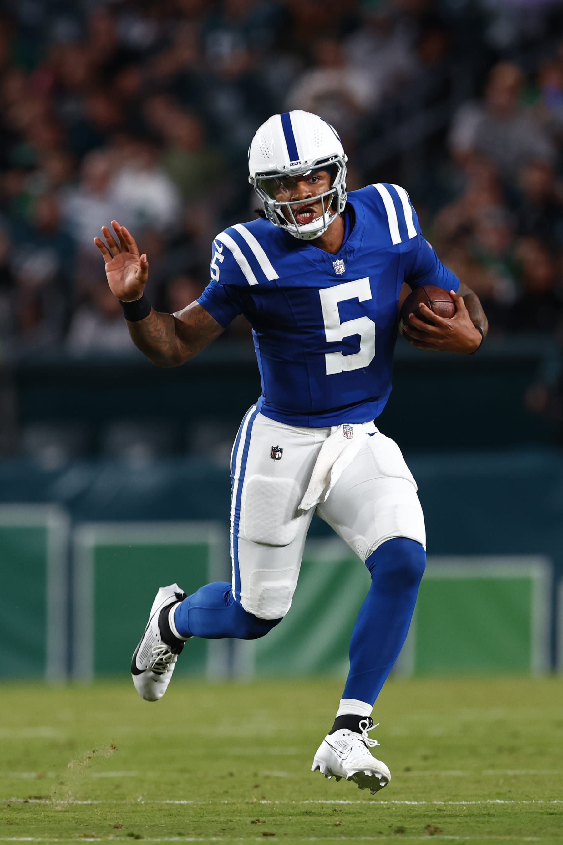 Indianapolis Colts quarterback Anthony Richardson (5) runs for a first down against the Philadelphia Eagles during the first half of an NFL pre-season football game, Thursday, Aug. 24, 2023, in Philadelphia. The Colts defeated the Eagles 27-13. (AP Photo/Rich Schultz)