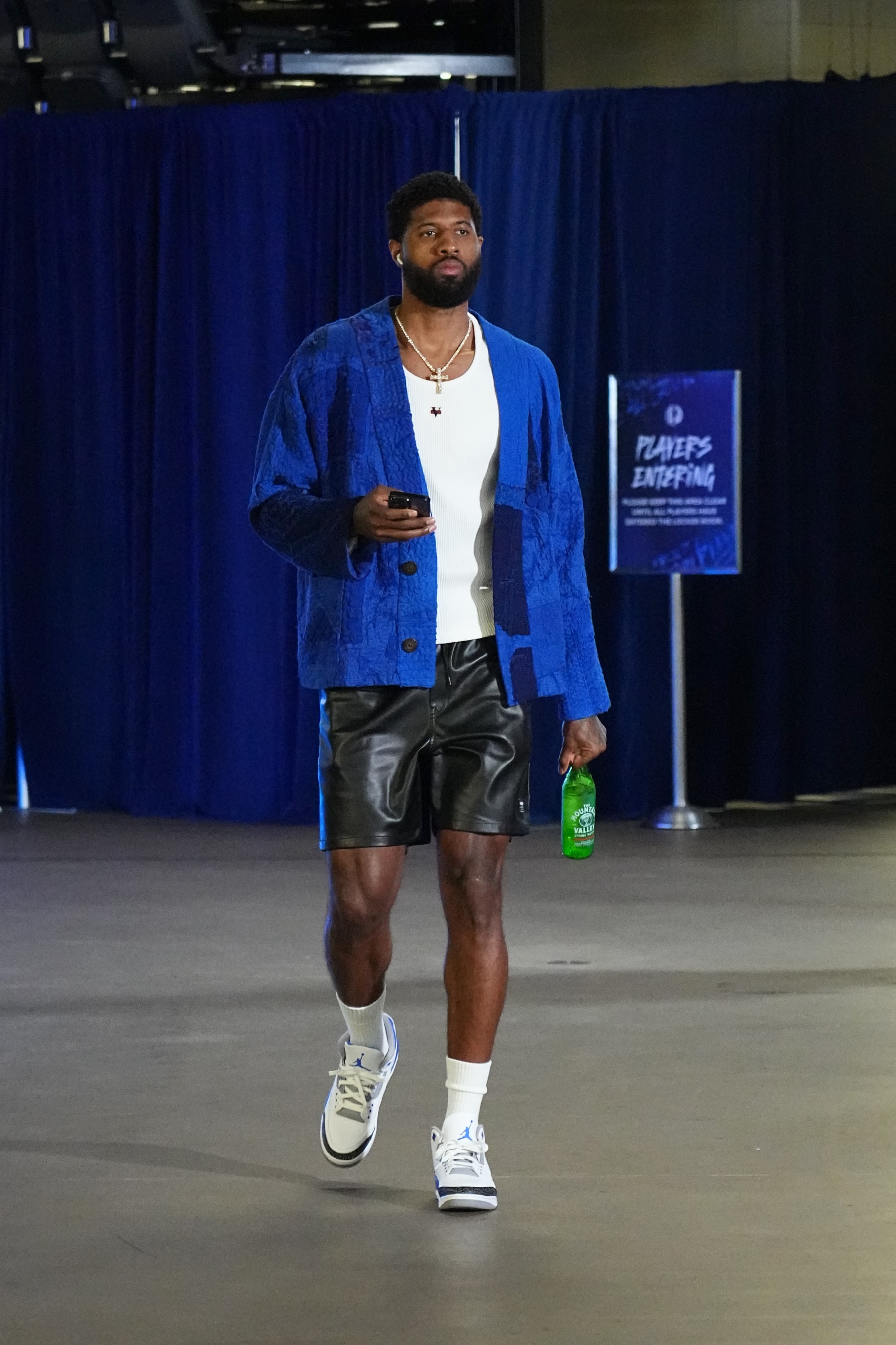 DALLAS, TX - MAY 3: Paul George #13 of the LA Clippers arrives to the arena before the game during Round 1 Game 6 of the 2024 NBA Playoffs  on May 3, 2024  at the American Airlines Center in Dallas, Texas. NOTE TO USER: User expressly acknowledges and agrees that, by downloading and or using this photograph, User is consenting to the terms and conditions of the Getty Images License Agreement. Mandatory Copyright Notice: Copyright 2024 NBAE (Photo by Glenn James/NBAE via Getty Images)