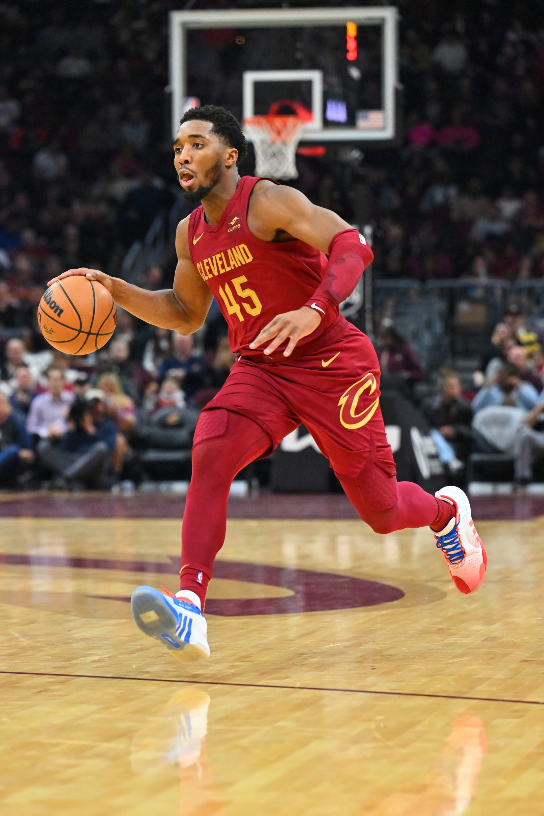 CLEVELAND, OHIO - DECEMBER 16: Donovan Mitchell #45 of the Cleveland Cavaliers brings the ball up court during the third quarter against the Atlanta Hawks at Rocket Mortgage Fieldhouse on December 16, 2023 in Cleveland, Ohio. The Cavaliers defeated the Hawks 127-119. NOTE TO USER: User expressly acknowledges and agrees that, by downloading and or using this photograph, User is consenting to the terms and conditions of the Getty Images License Agreement. (Photo by Jason Miller/Getty Images)