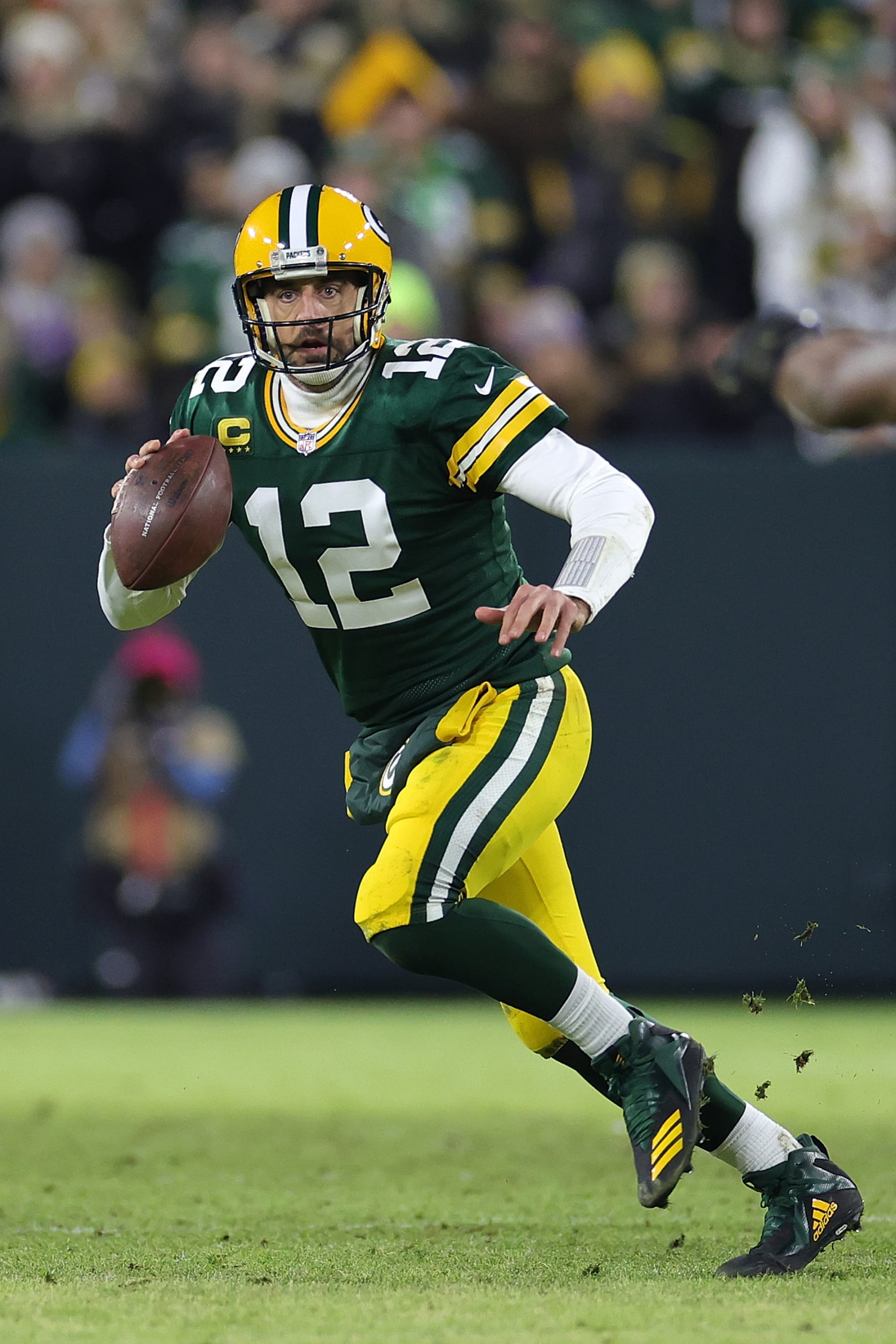 GREEN BAY, WISCONSIN - JANUARY 01: Aaron Rodgers #12 of the Green Bay Packers looks to pass during a game against the Minnesota Vikings at Lambeau Field on January 01, 2023 in Green Bay, Wisconsin. The Packers defeated the Vikings 41-17.  (Photo by Stacy Revere/Getty Images)
