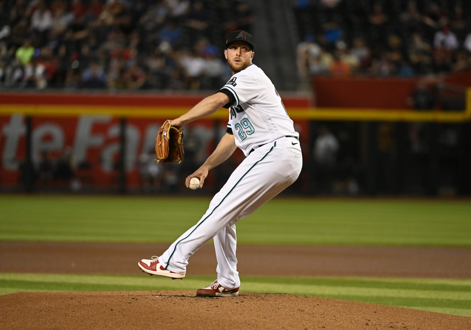 PHOENIX, ARIZONA - JUNE 14: Merrill Kelly #29 of the Arizona Diamondbacks delivers a pitch against the Philadelphia Phillies at Chase Field on June 14, 2023 in Phoenix, Arizona. (Photo by Norm Hall/Getty Images)
