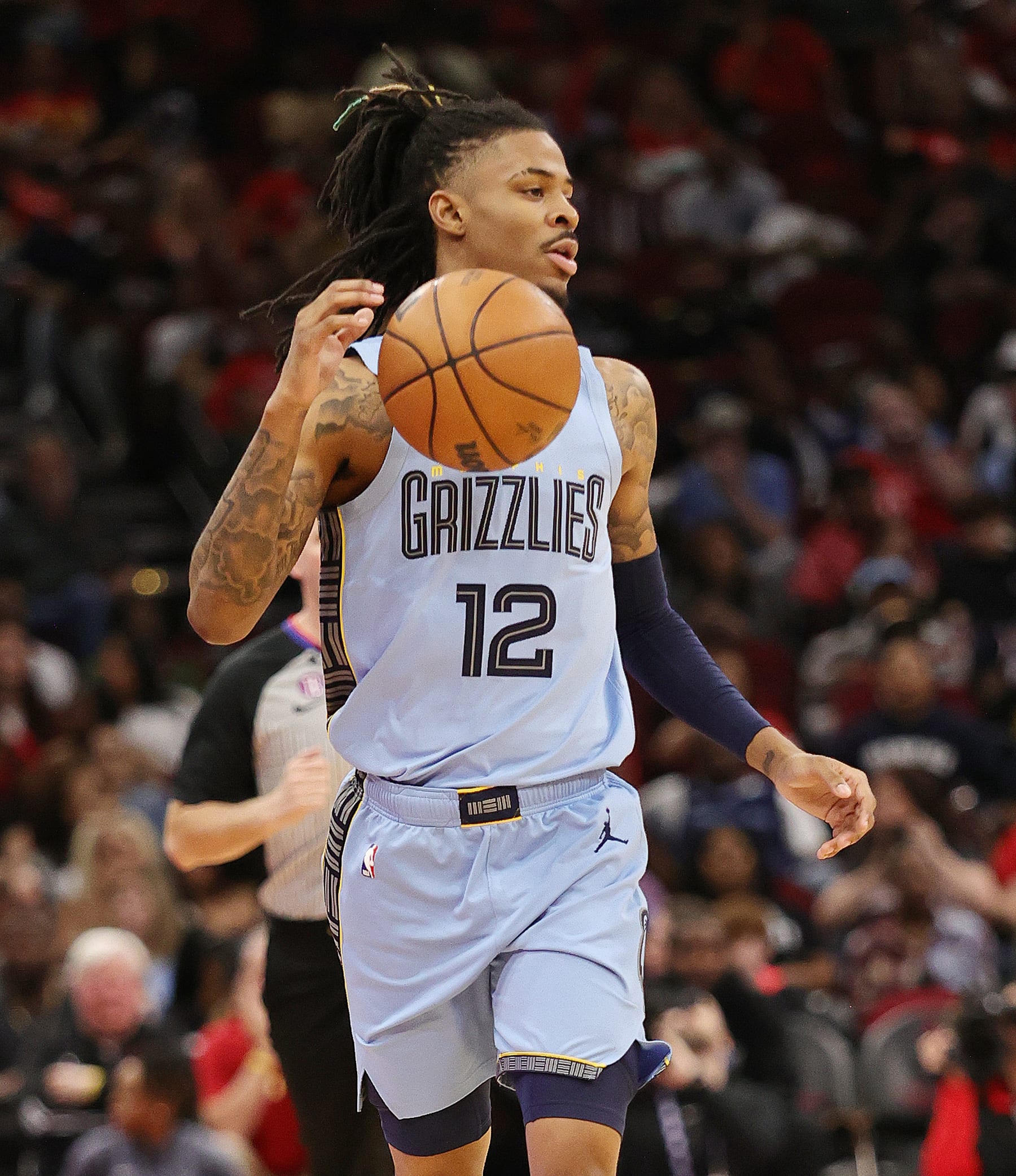 HOUSTON, TEXAS - MARCH 01: Ja Morant #12 of the Memphis Grizzlies brings the ball up court against the Houston Rockets at Toyota Center on March 01, 2023 in Houston, Texas. NOTE TO USER: User expressly acknowledges and agrees that, by downloading and or using this photograph, User is consenting to the terms and conditions of the Getty Images License Agreement. (Photo by Bob Levey/Getty Images)