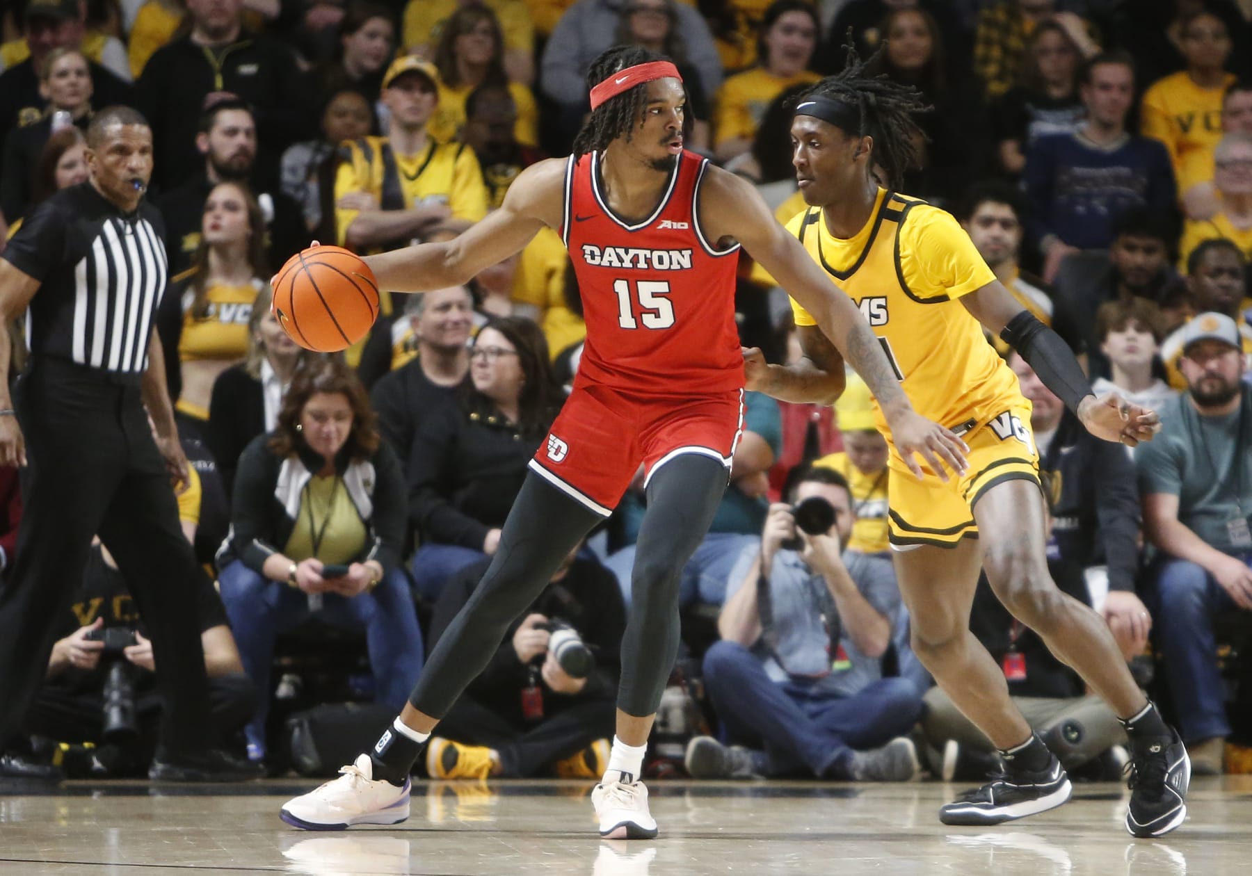RICHMOND, VA - FEBRUARY 09: VCU Rams forward Christian Fermin (21) attempts to defend Dayton Flyers forward DaRon Holmes II (15) during the men's college basketball game between the Dayton Flyers and the VCU Rams on February 09, 2024, at the Stuart C. Siegel Center in Richmond, VA. (Photo by Lee Coleman/Icon Sportswire via Getty Images)