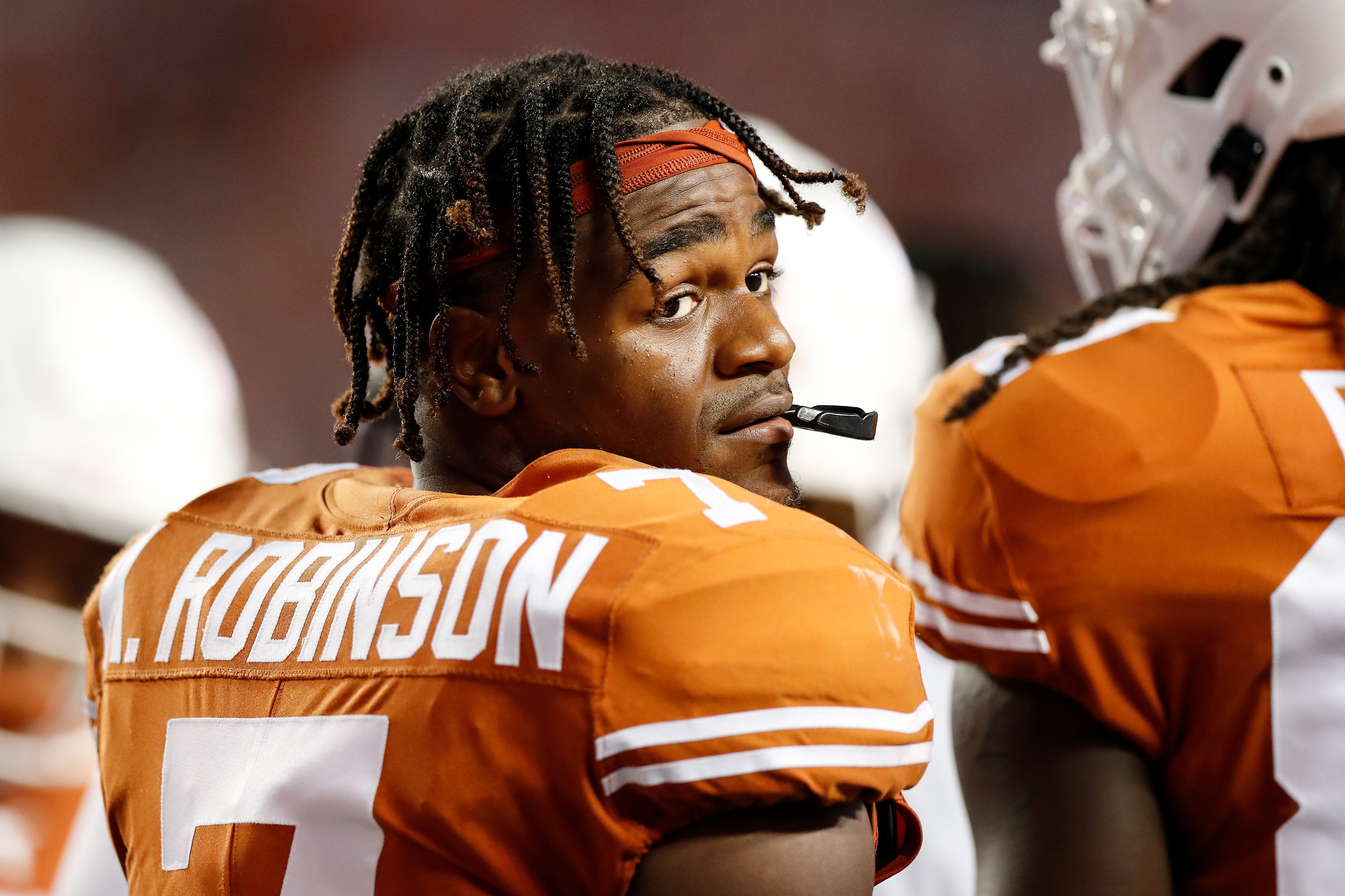 AUSTIN, TEXAS - SEPTEMBER 18: Keilan Robinson #7 of the Texas Longhorns reacts during a time out in the second half against the Rice Owls at Darrell K Royal-Texas Memorial Stadium on September 18, 2021 in Austin, Texas. (Photo by Tim Warner/Getty Images)