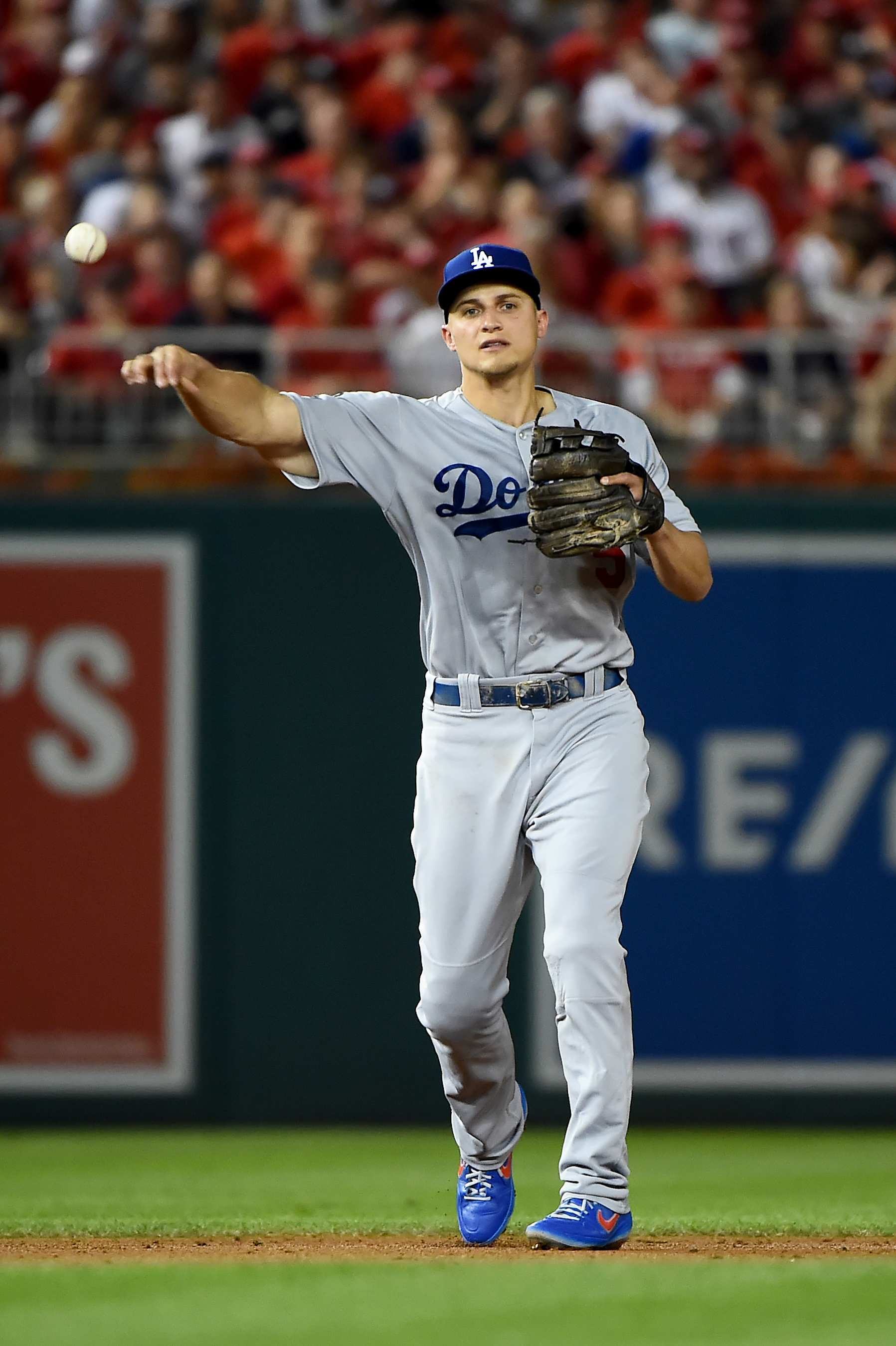 WASHINGTON, DC - OCTOBER 06: Corey Seager #5 of the Los Angeles Dodgers throws to first base against the Washington Nationals in game three of the National League Division Series at Nationals Park on October 6, 2019 in Washington, DC. (Photo by Will Newton/Getty Images)