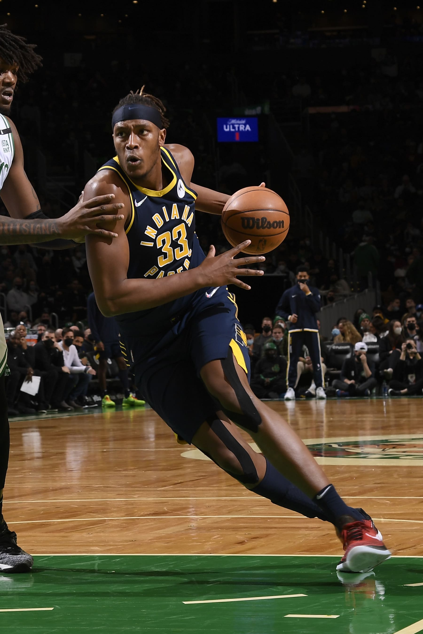 BOSTON, MA - JANUARY 10: Myles Turner #33 of the Indiana Pacers dribbles the ball during the game against the Boston Celtics on January 10, 2022 at the TD Garden in Boston, Massachusetts.  NOTE TO USER: User expressly acknowledges and agrees that, by downloading and or using this photograph, User is consenting to the terms and conditions of the Getty Images License Agreement. Mandatory Copyright Notice: Copyright 2022 NBAE  (Photo by Brian Babineau/NBAE via Getty Images)